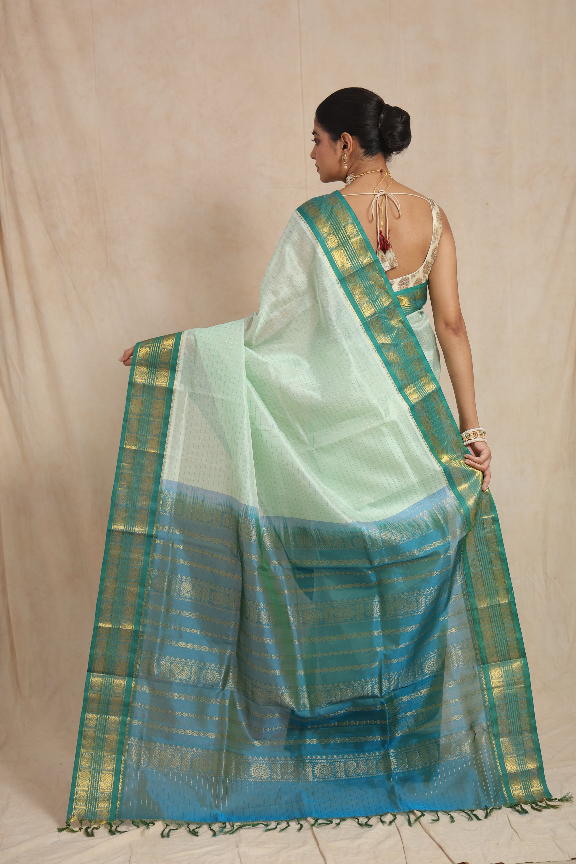 Back view of pastel mint green Kanchipuram Sico saree with rich woven pallu