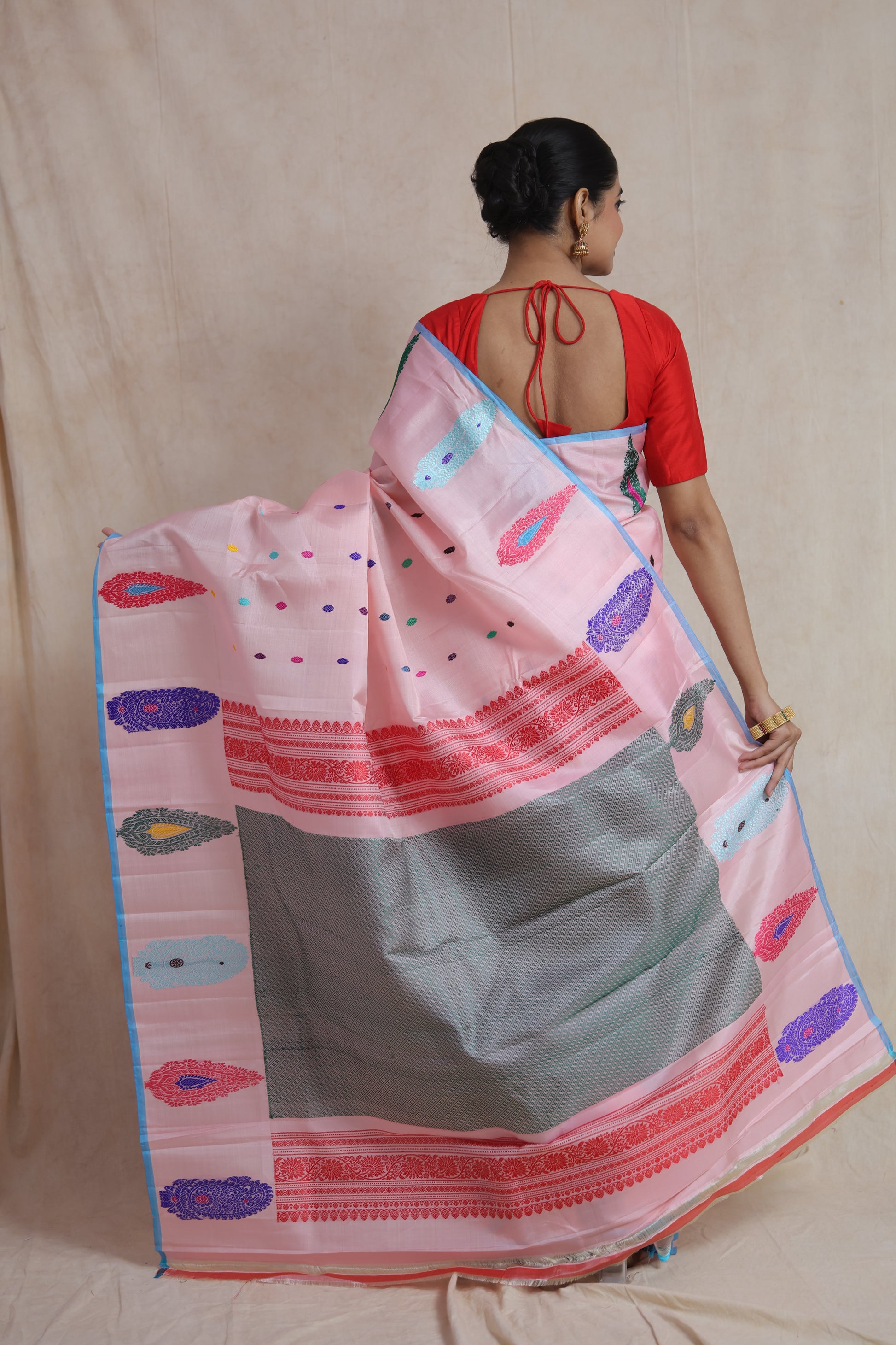 Back view of pastel pink Gadwal silk saree with woven pallu