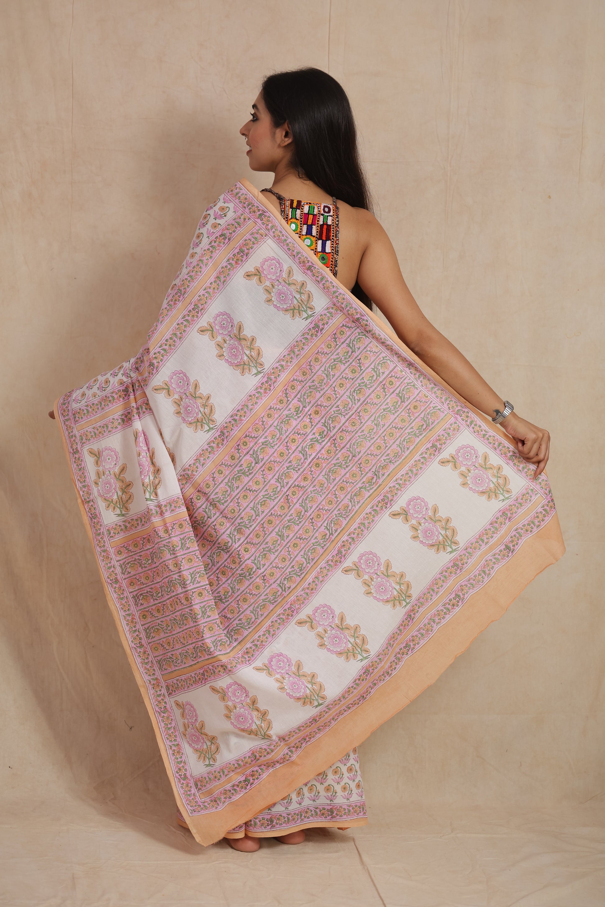 Back pallu view of pastel pink floral Sanganeri cotton saree