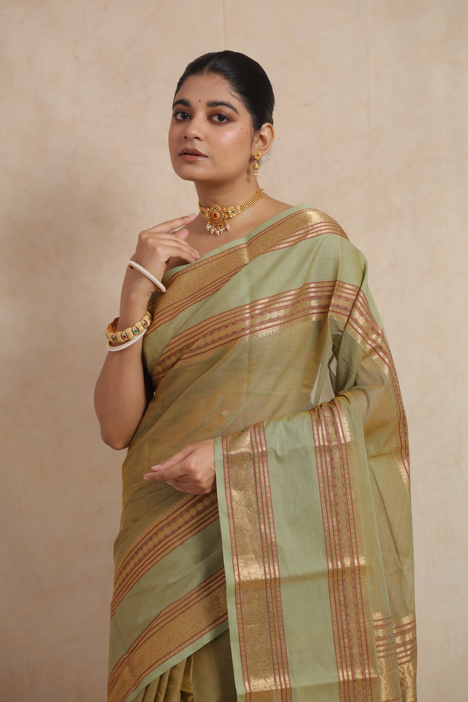 Classic styling in pastel sage green Kanchipuram cotton saree