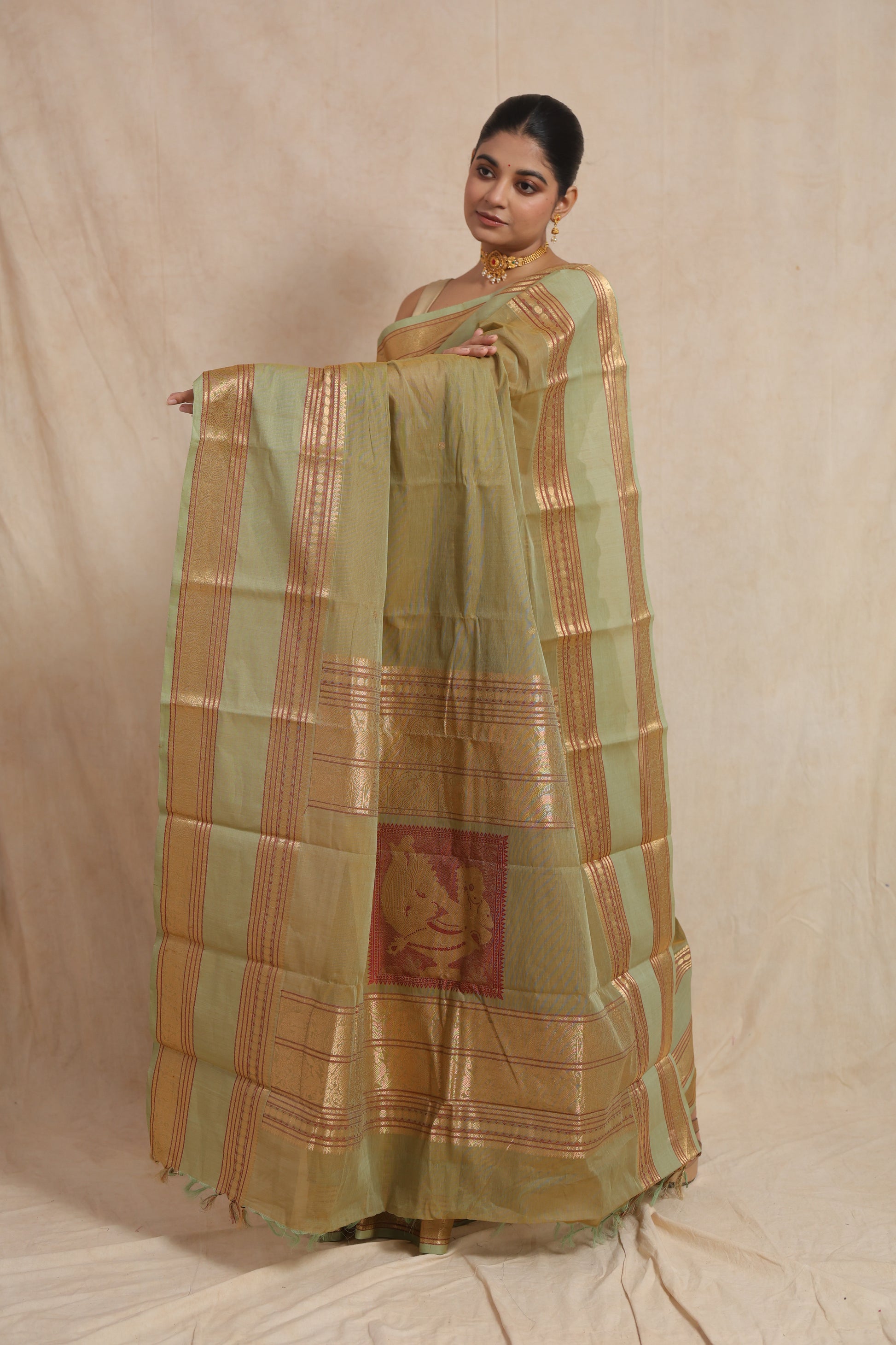 Detailed pallu view of pastel sage green Kanchipuram cotton saree