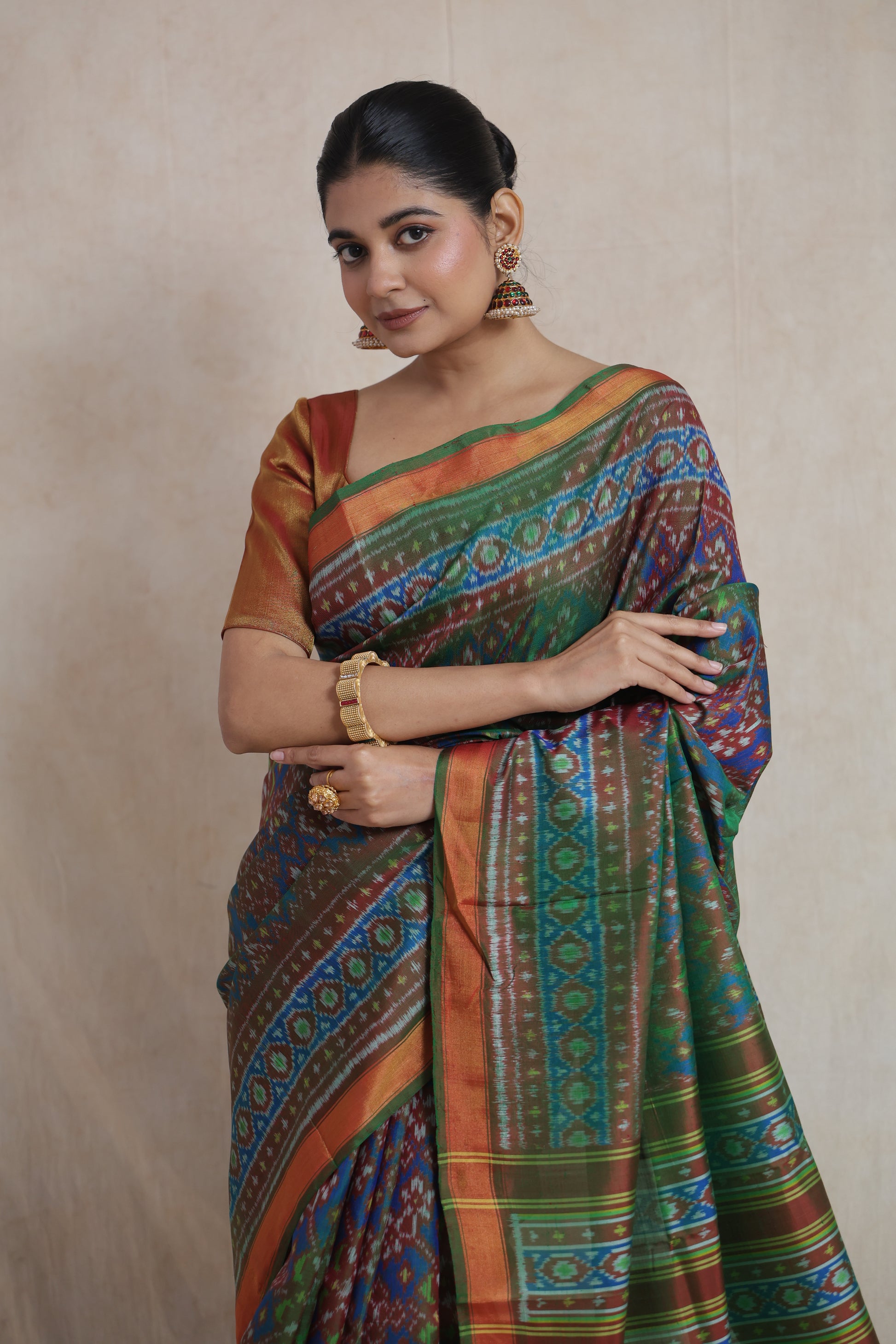 Close-up of handwoven Patola silk saree showcasing intricate geometric ikat patterns