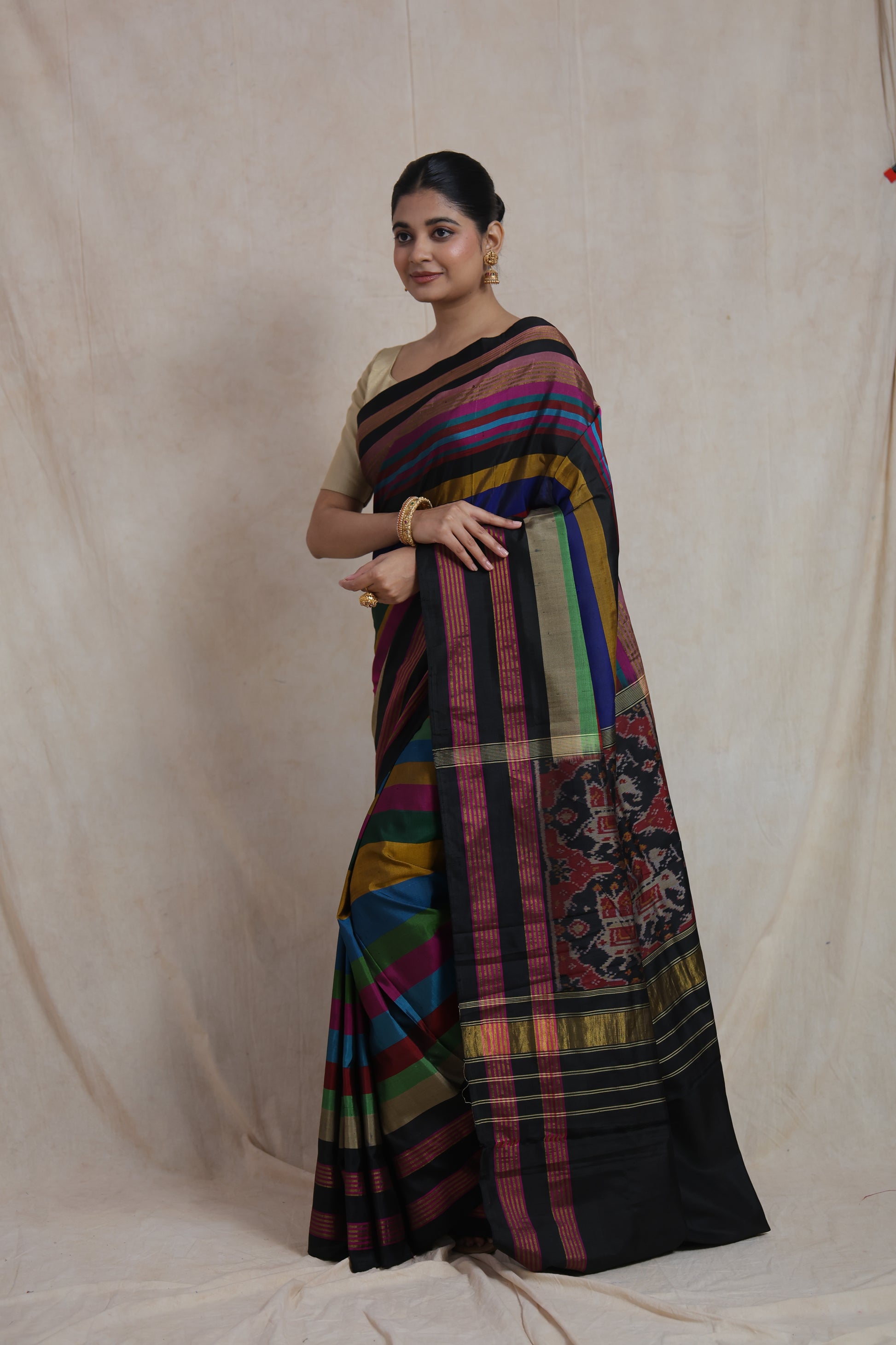 Portrait styling of multicolor Patola silk saree with black border