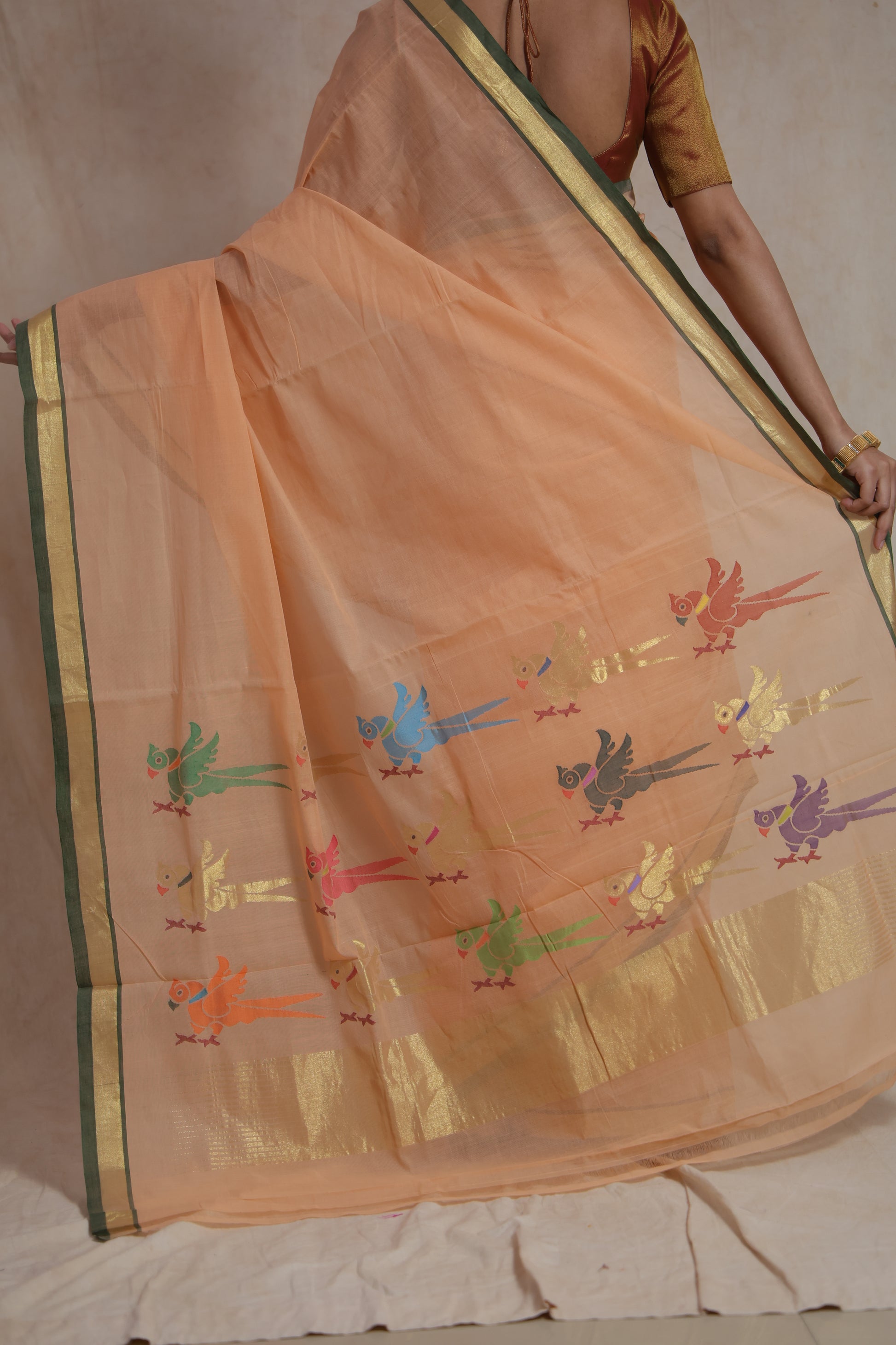 Detailed pallu view of peach Kanchipuram cotton saree with bird motifs