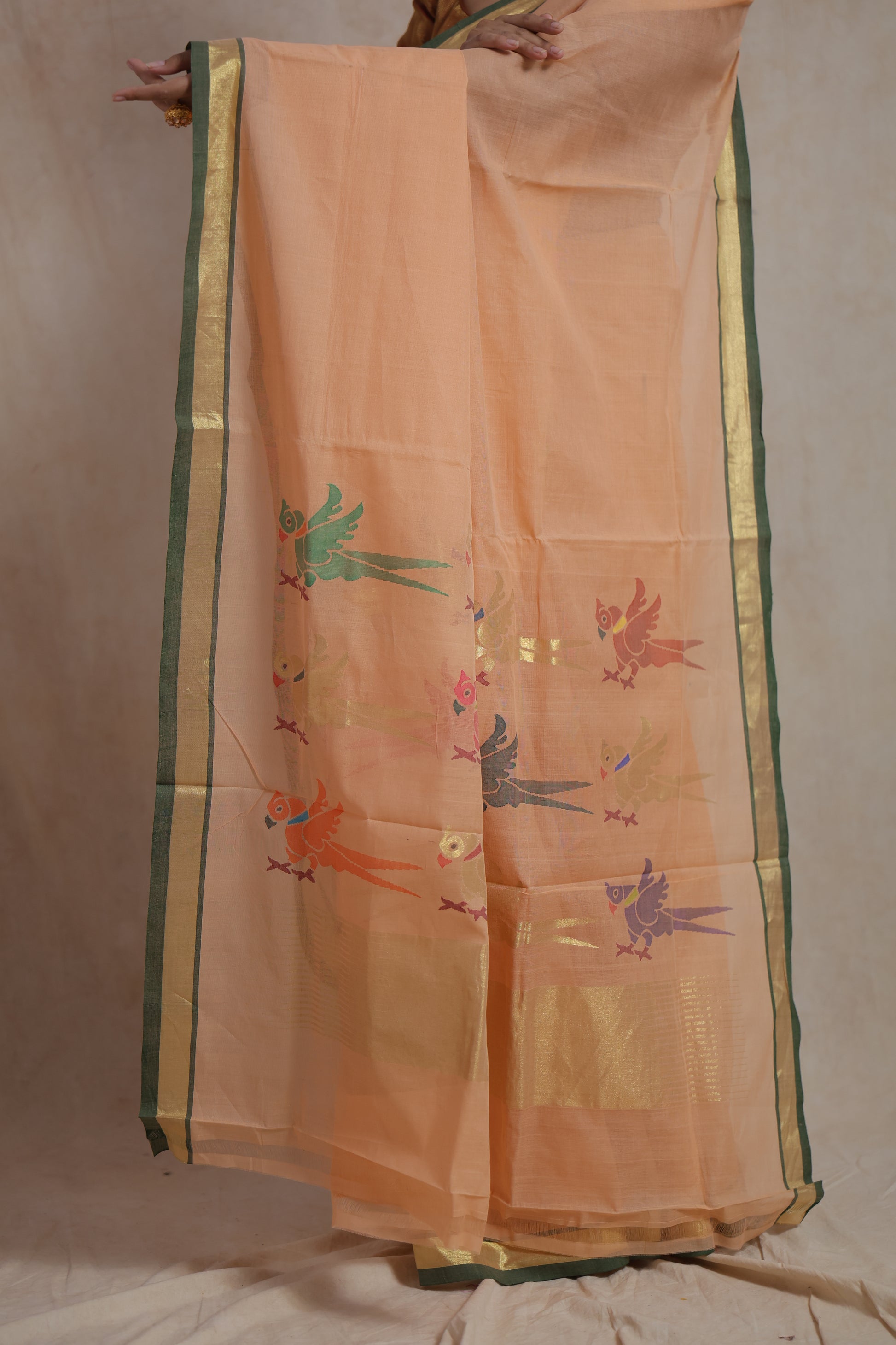 Peach Kanchipuram cotton saree with multicolor bird motif pallu