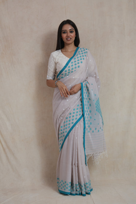 Front view of pearl grey Bengal Cotton Fulia saree with aqua blue geometric woven border
