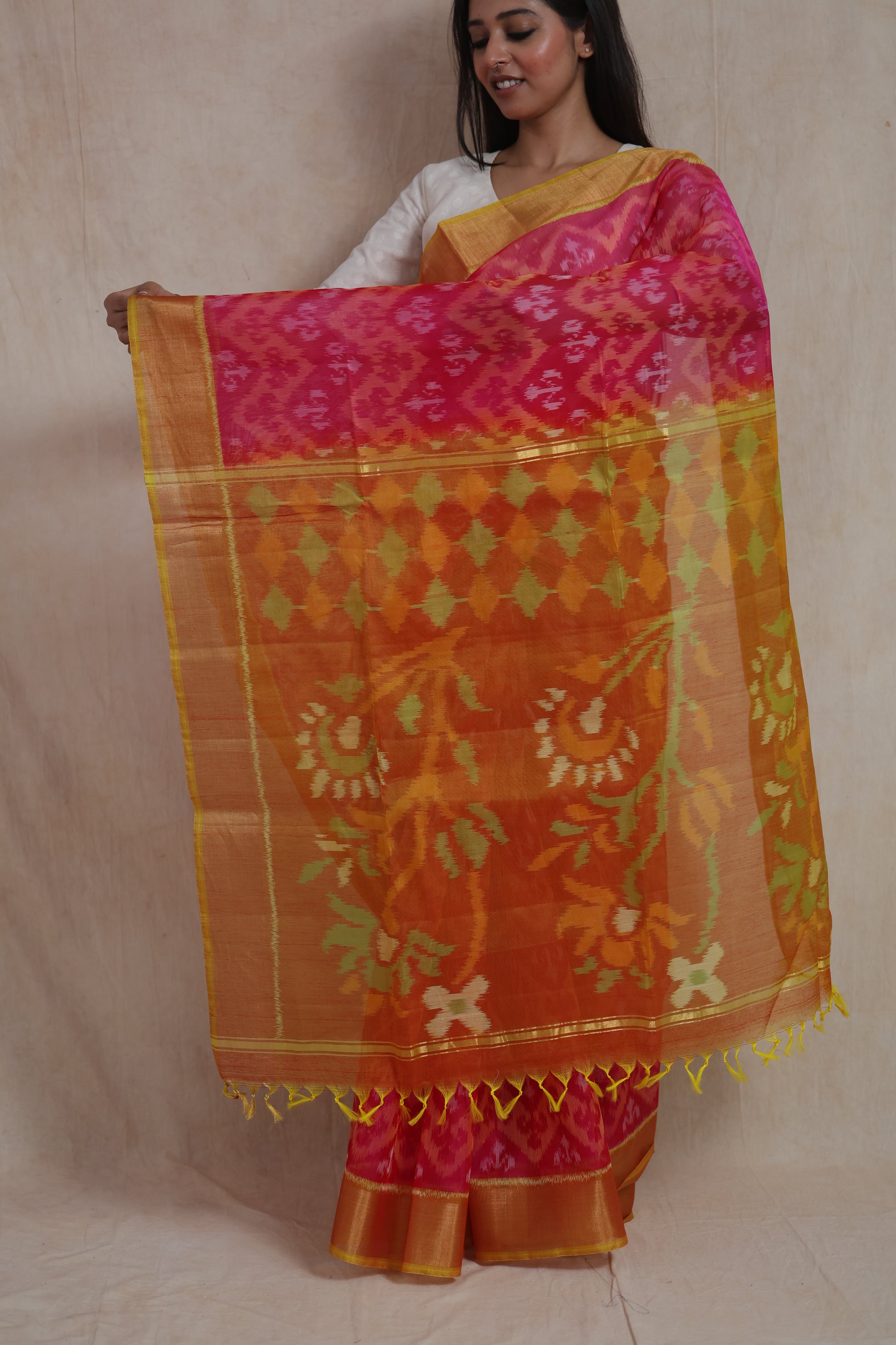 Detailed pallu view of Rani pink Pochampally silk cotton saree with floral motifs