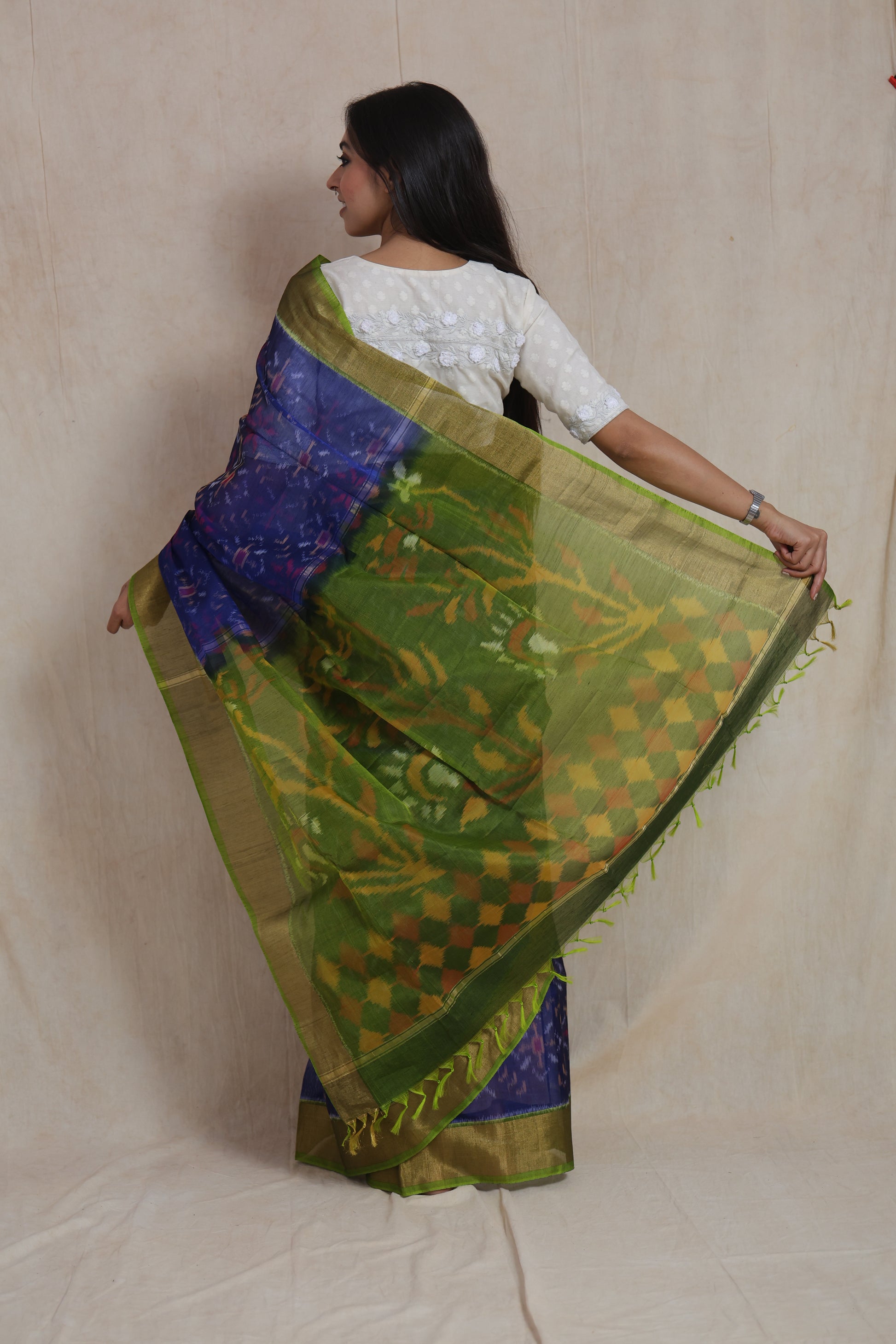 Panchampali handloom silk cotton saree showcasing olive green floral pallu with traditional woven motifs