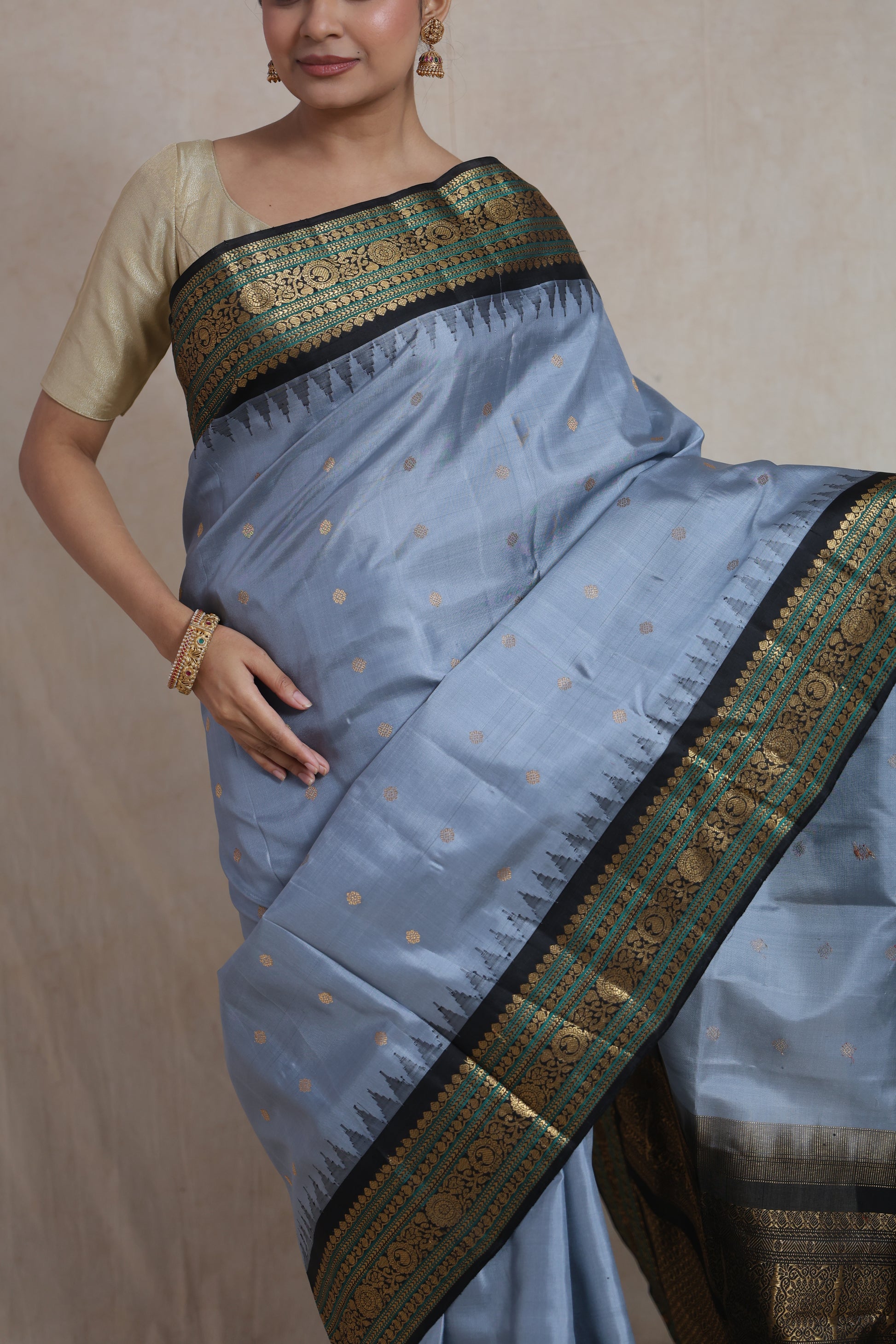 Close-up of powder blue Gadwal Silk saree featuring delicate woven buttas and ornate border