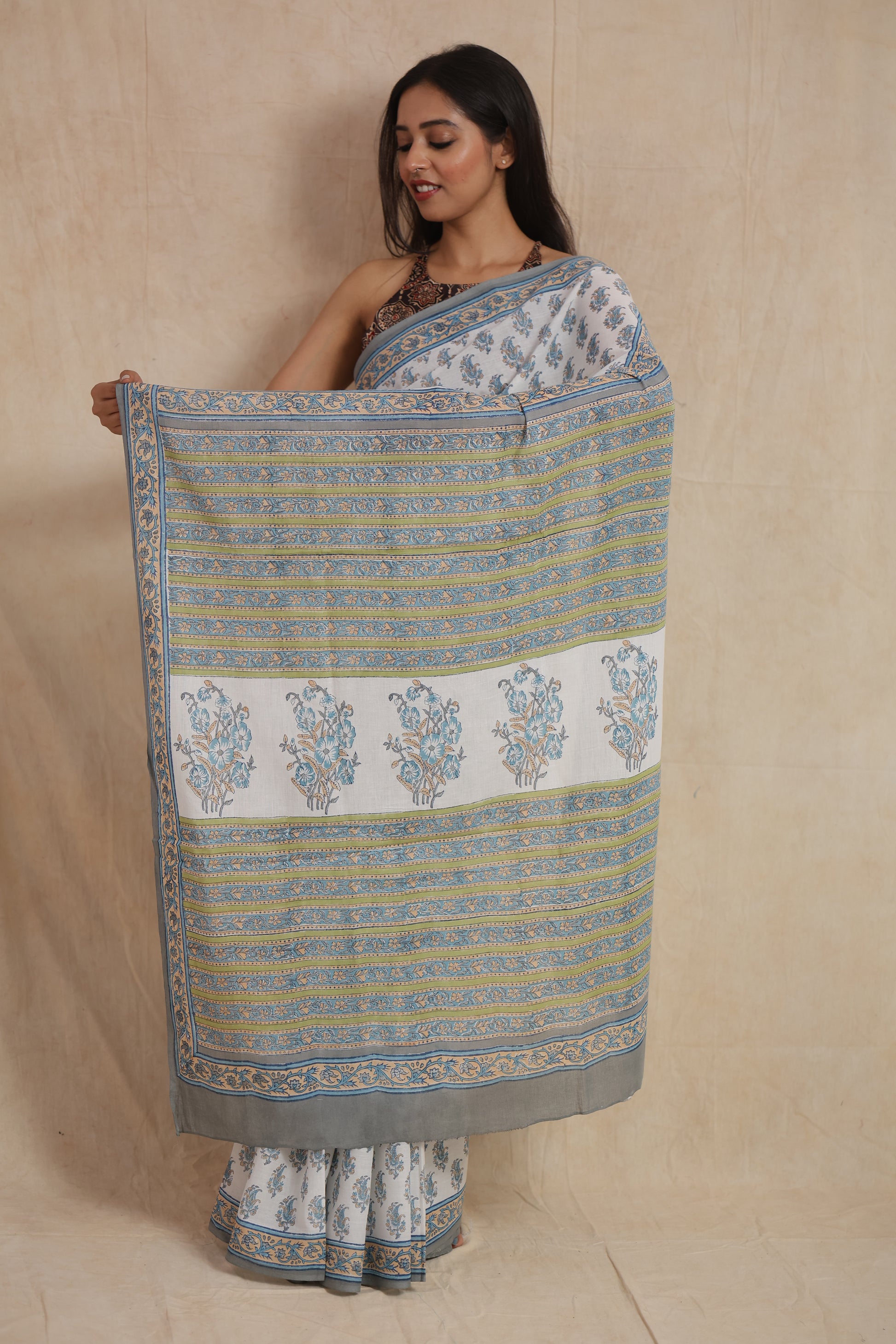 Open pallu display of powder blue Sanghnaree cotton saree with floral motifs
