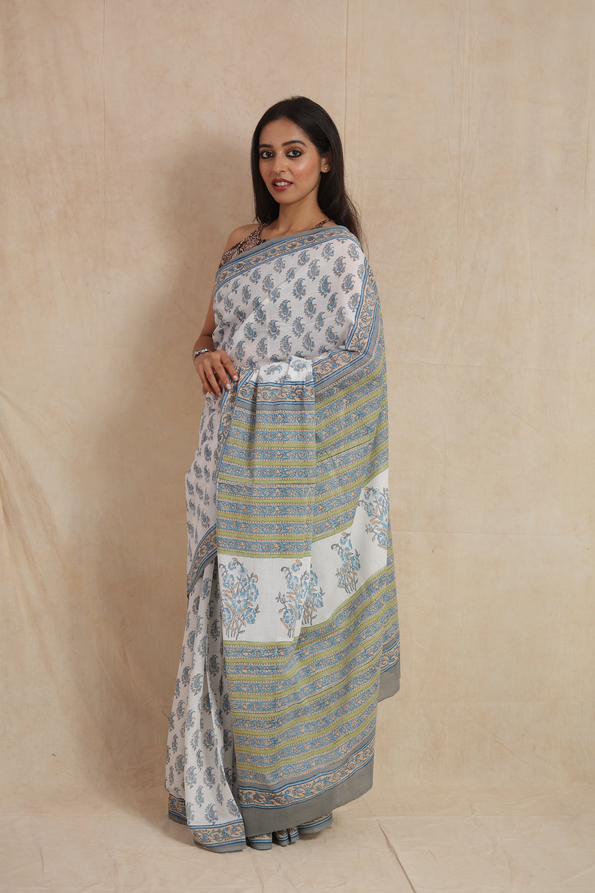 Side profile of powder blue Sanghnaree cotton saree with striped pallu
