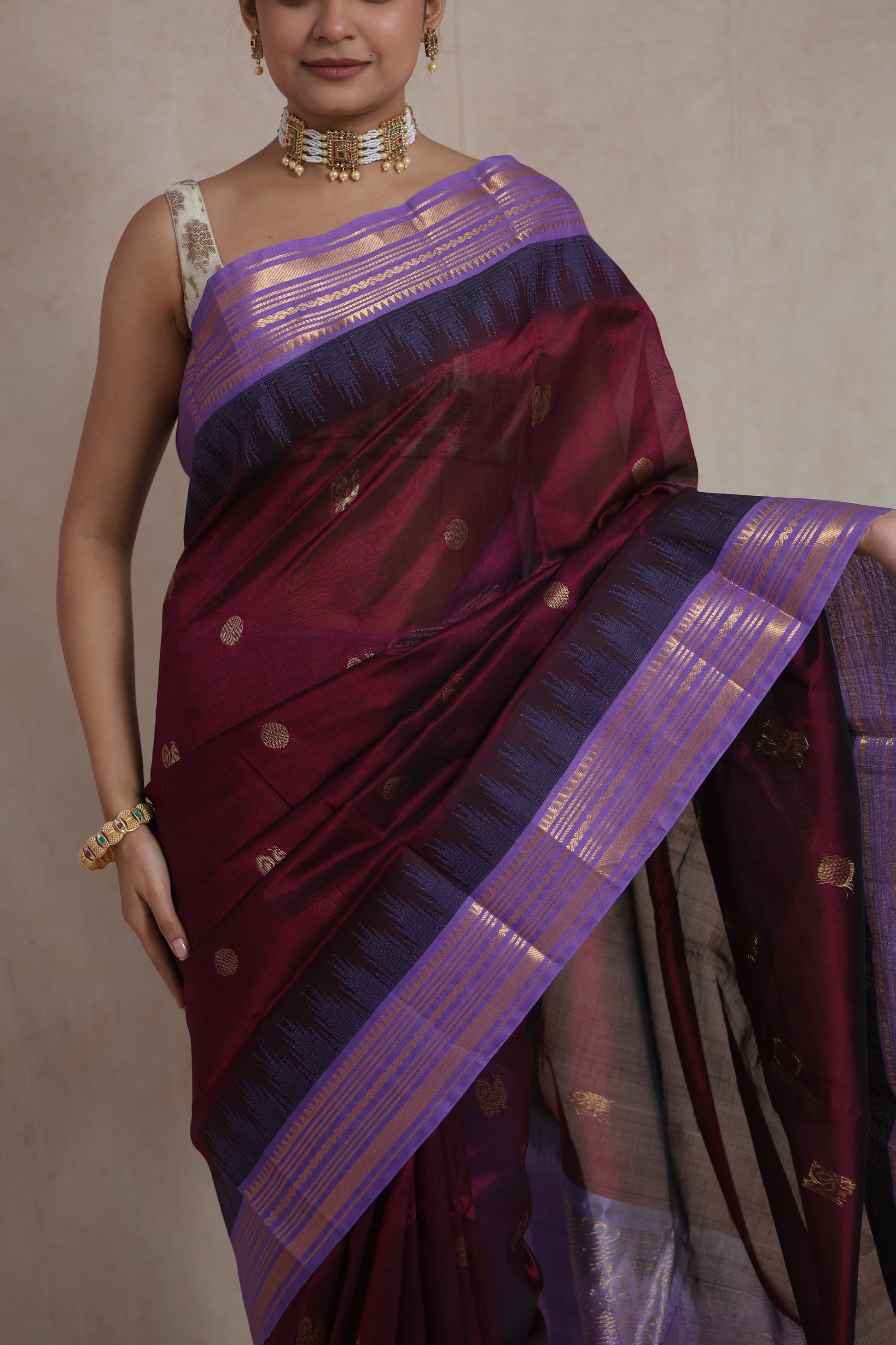 Premium Kanjipuram silk cotton saree with woven zari motifs and rich texture