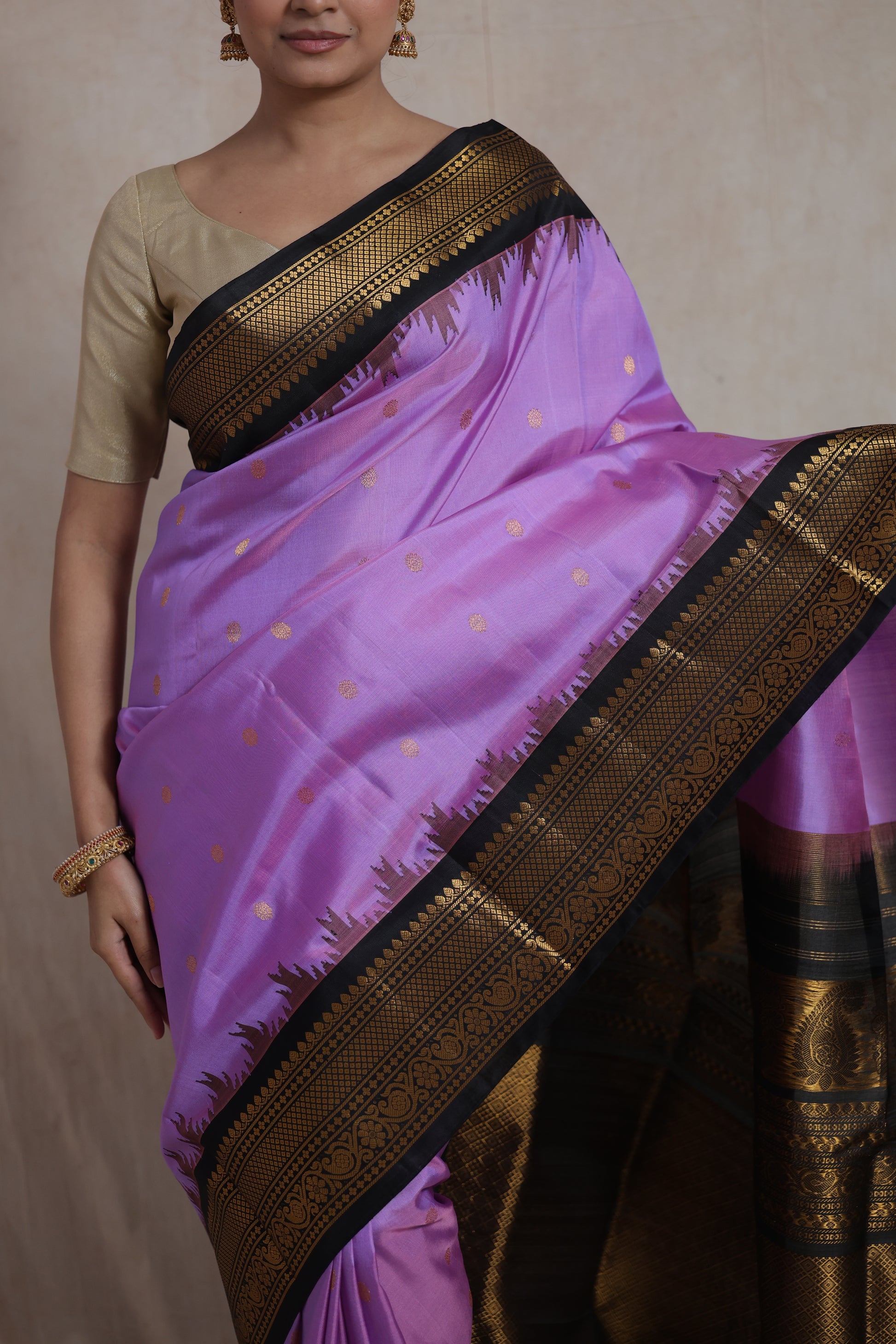 Close-up of lavender Gadwal silk saree with zari buttas and woven border