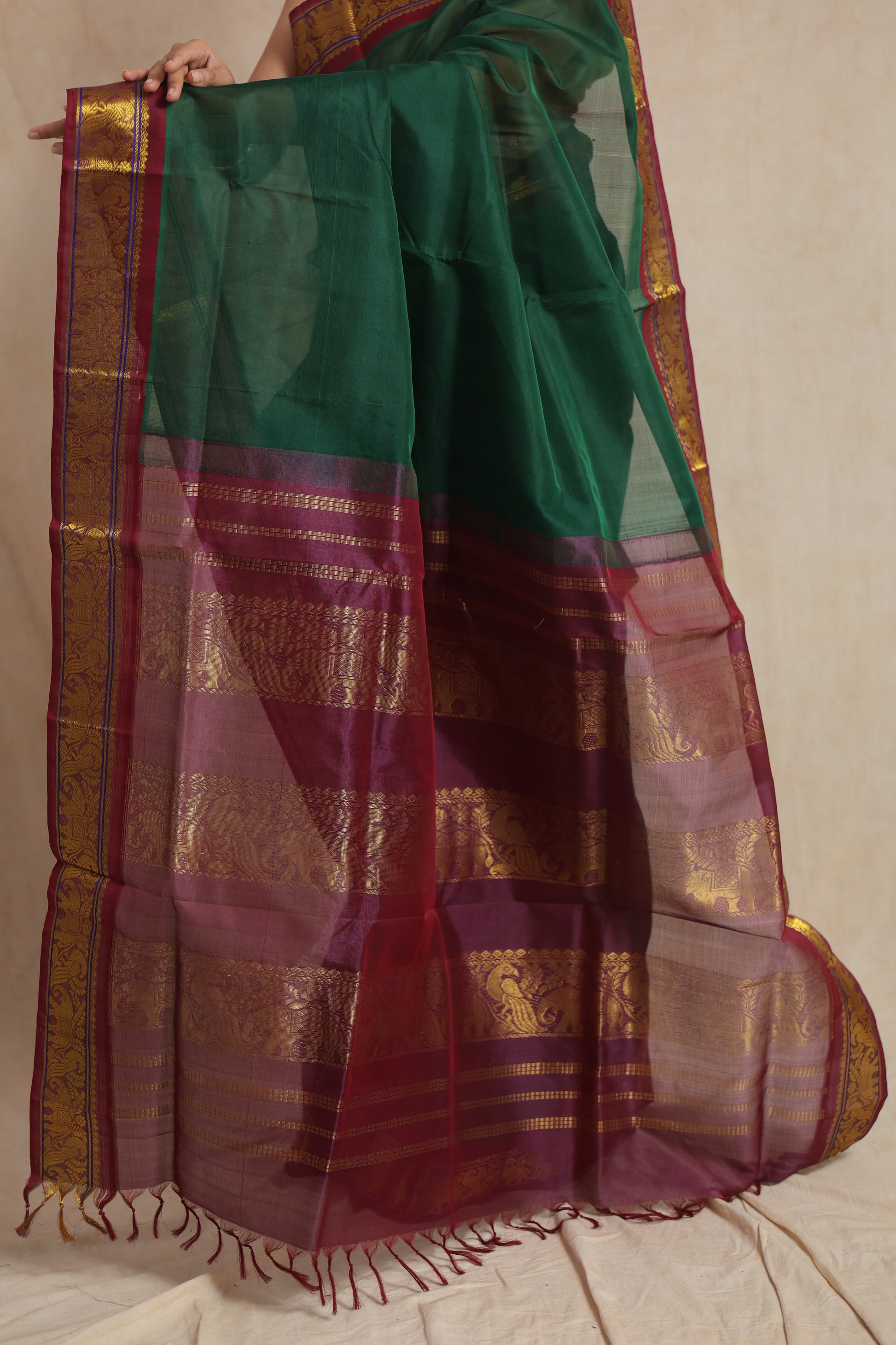 Detailed view of the wine purple pallu with intricate traditional woven patterns on Kanchipuram SICO saree
