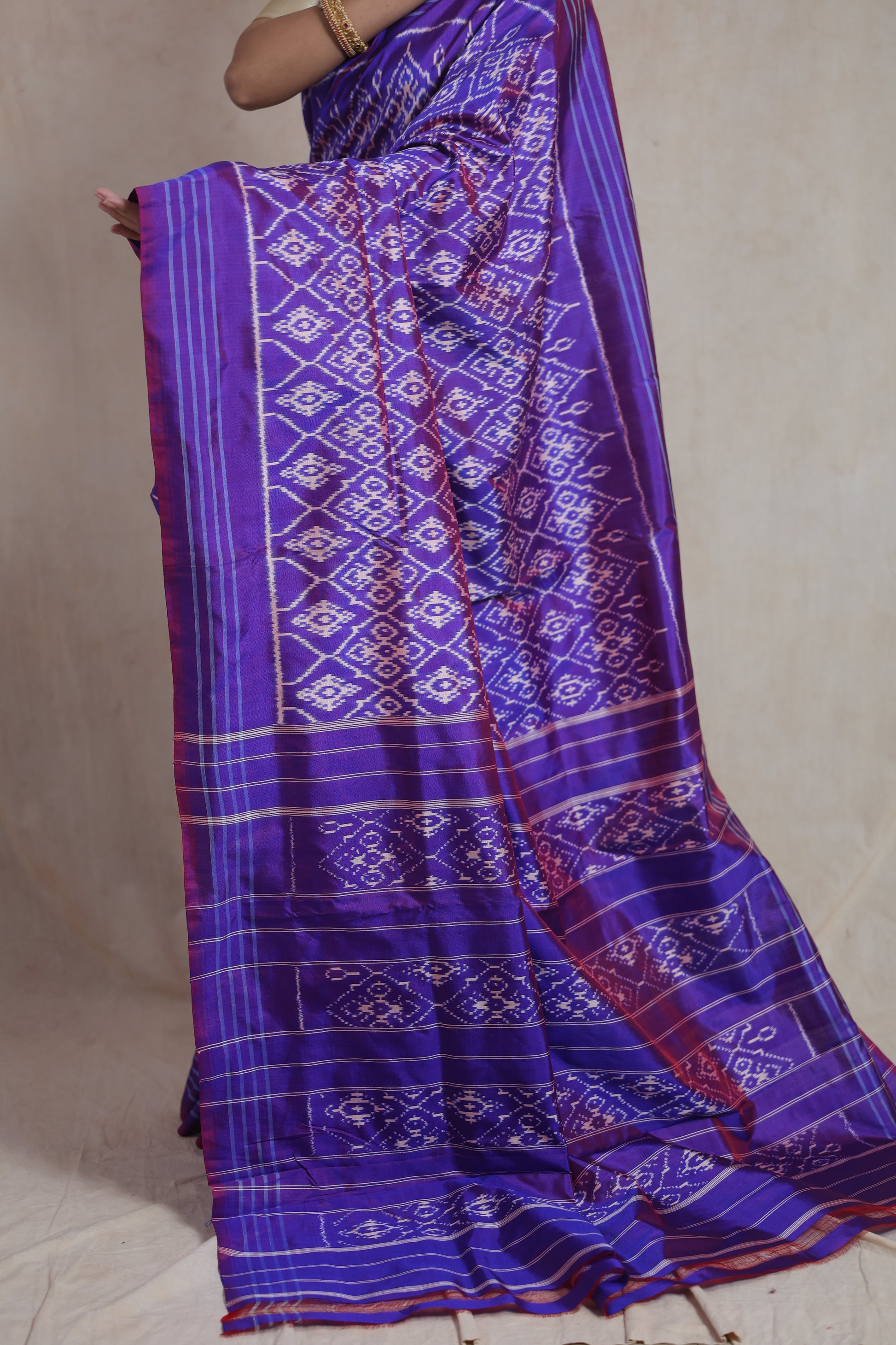 Side profile view of royal purple Panchampali silk saree with traditional weaving