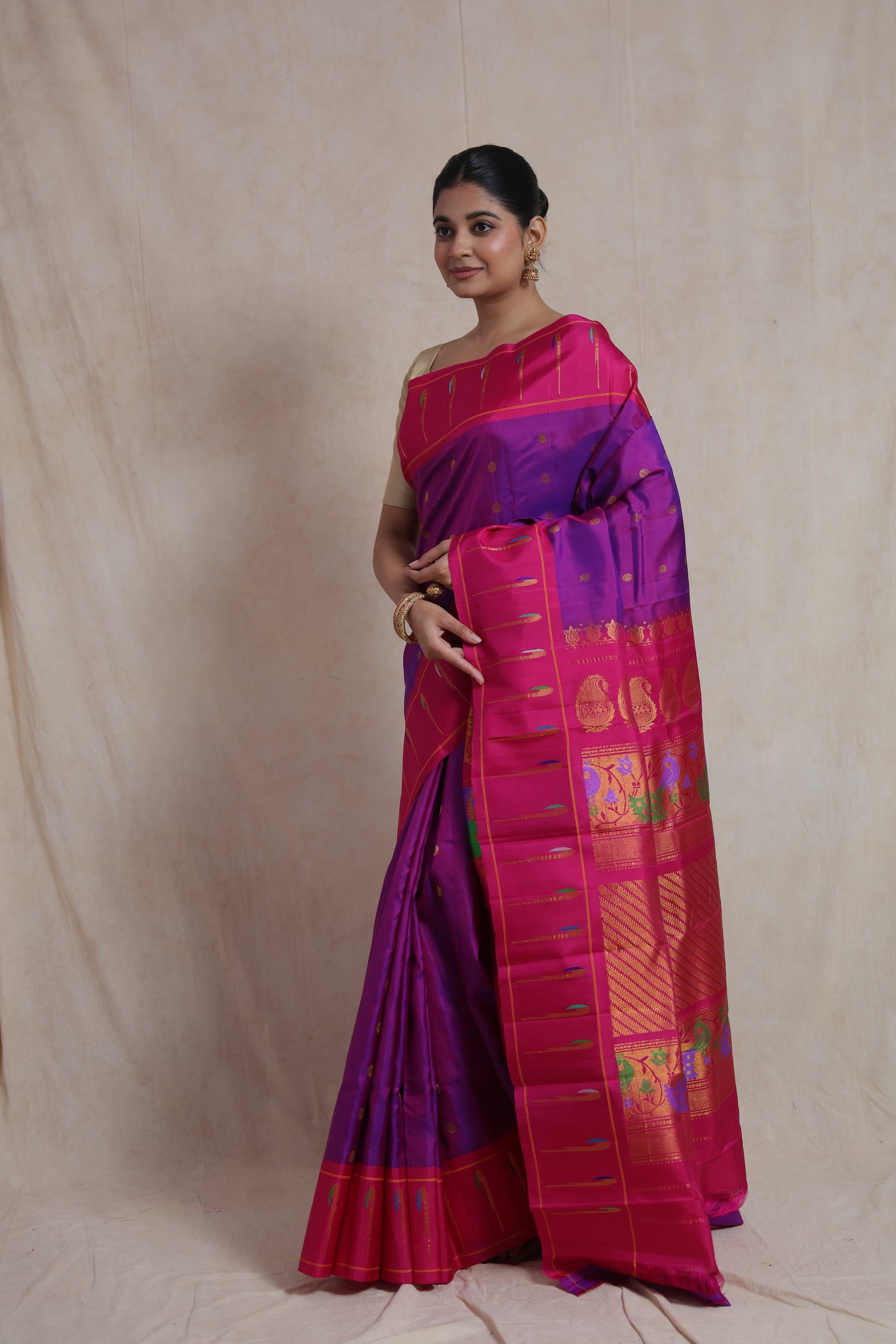 Elegant pose in royal purple Gadwal silk saree with pink zari border