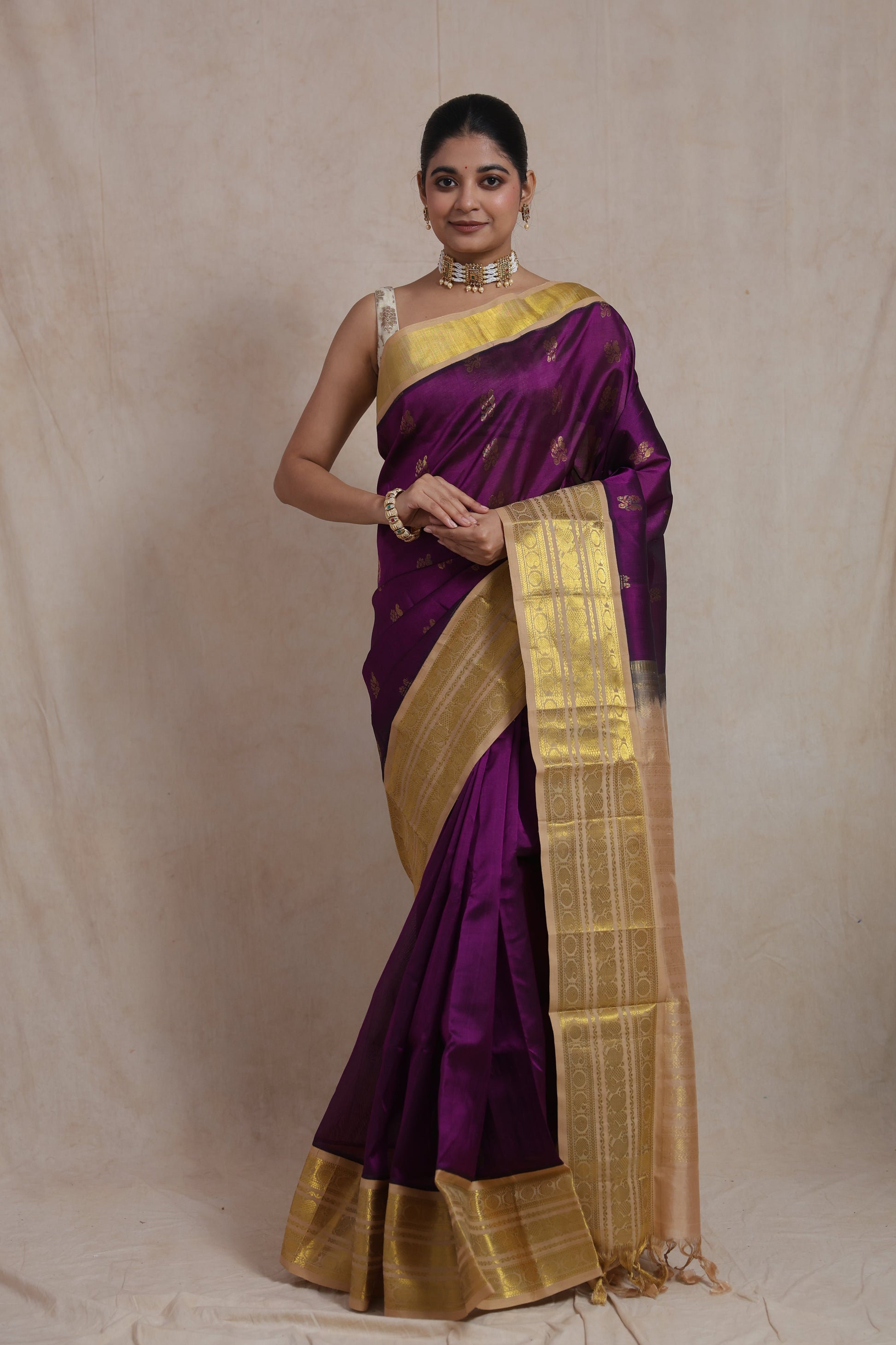 Full-length view of royal purple Kanchipuram SICO saree with traditional gold woven border and pallu