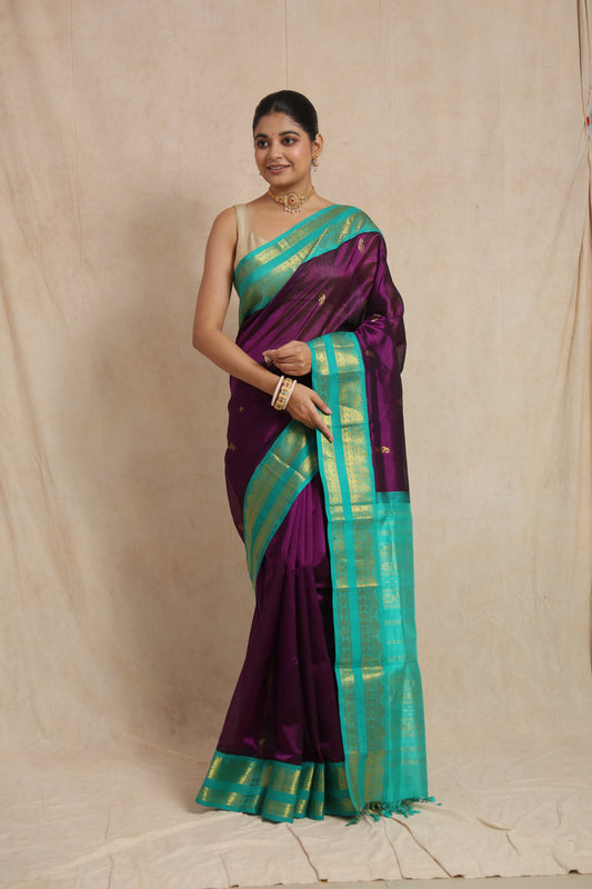 Full view of royal purple Kanchipuram Sico saree with aqua blue zari border