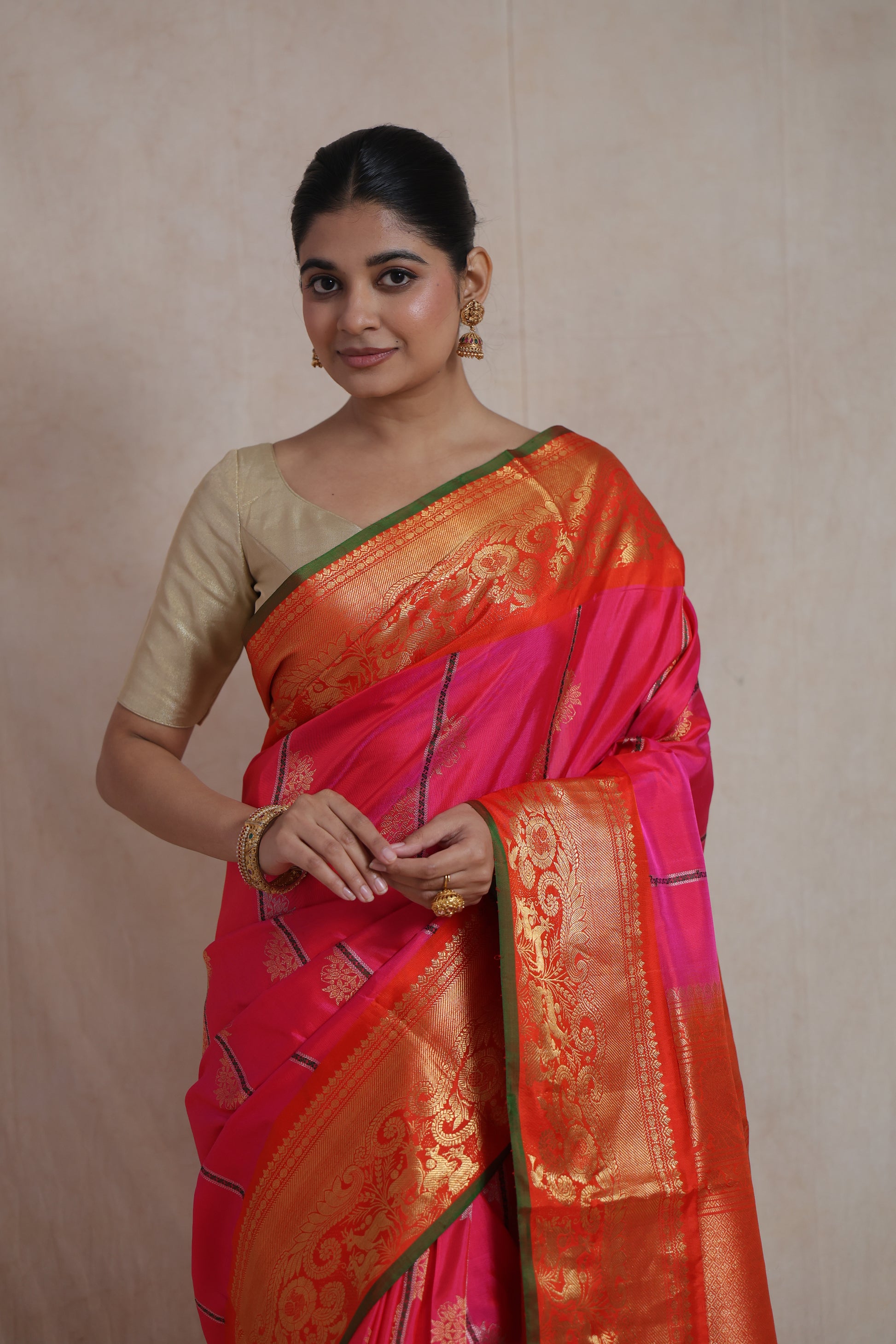 Elegant portrait view of rani pink Gadwal SICO saree with traditional woven border
