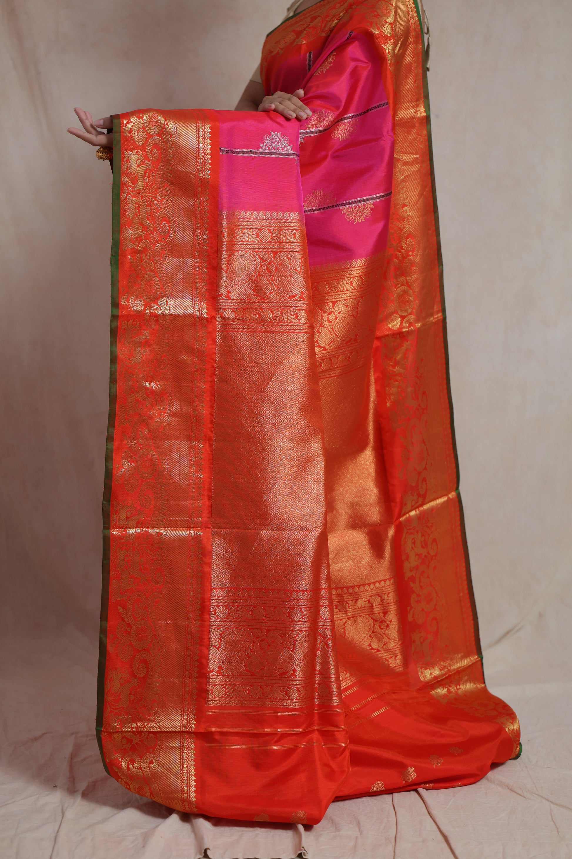 Detailed view of orange and gold woven pallu on Gadwal SICO saree