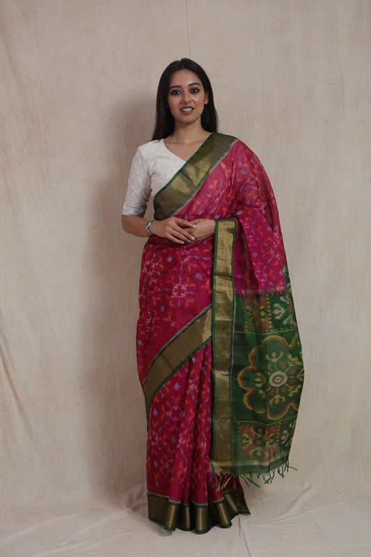 Front view of rani pink Panchampali SICO saree with emerald green pallu and traditional woven