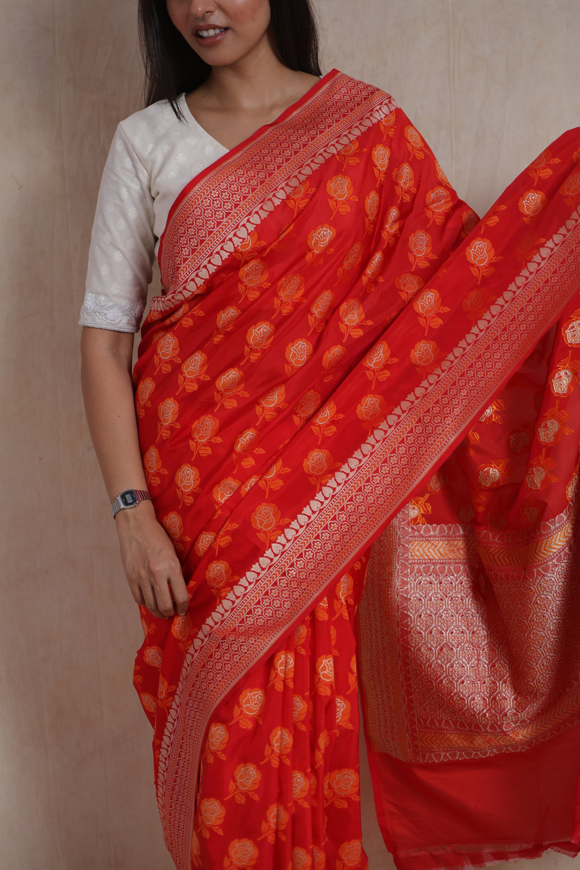 Close-up of Banarasi art silk saree featuring floral zari buttas and woven border
