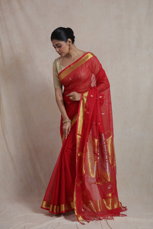 Shop elegant red Kanchipuram cotton saree with gold border, woven buttas, and artistic pallu. Perfect for festive and cultural occasions.