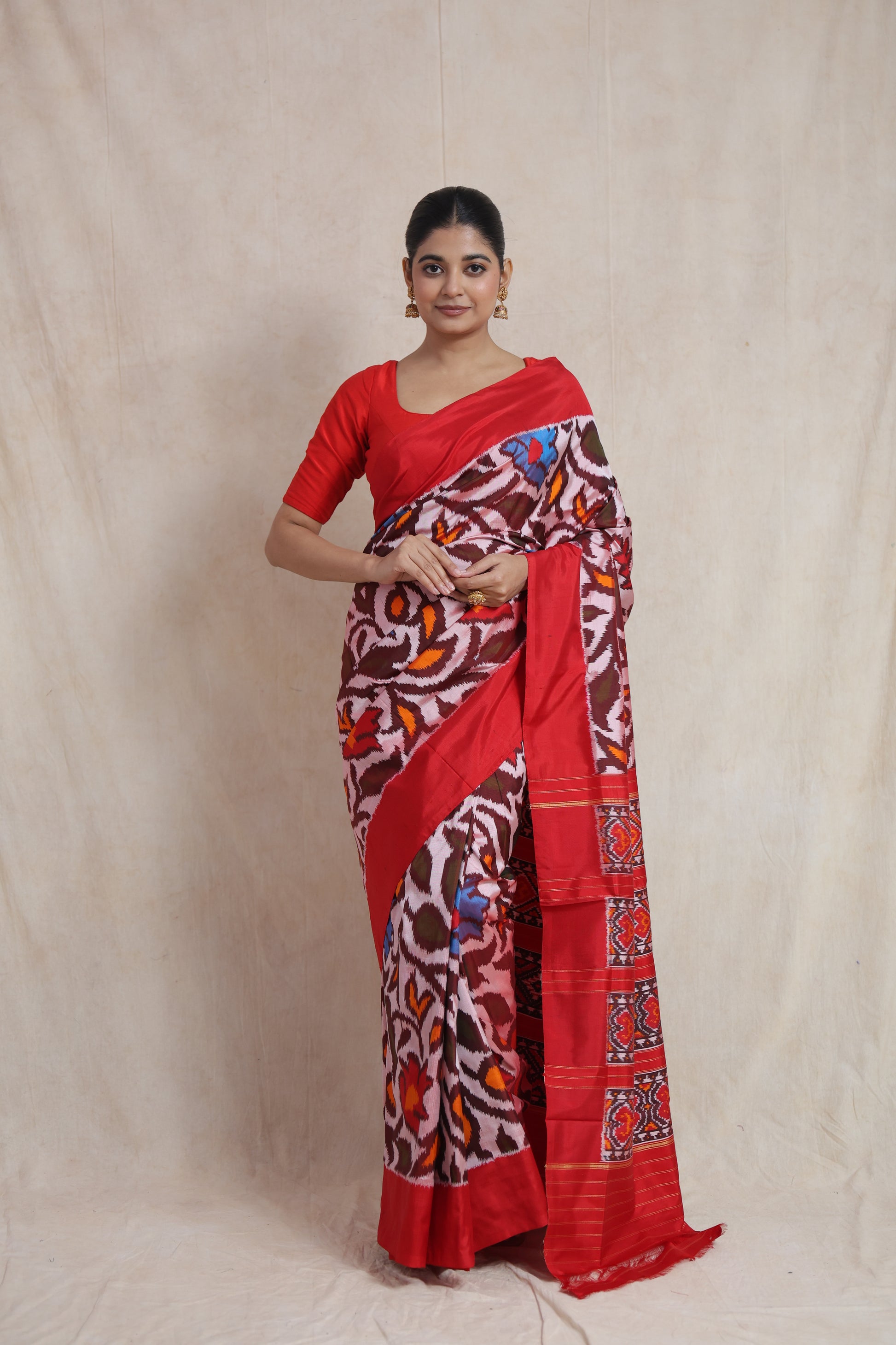 Full-length view of crimson red Panchampali handloom silk saree with artistic floral ikat weave