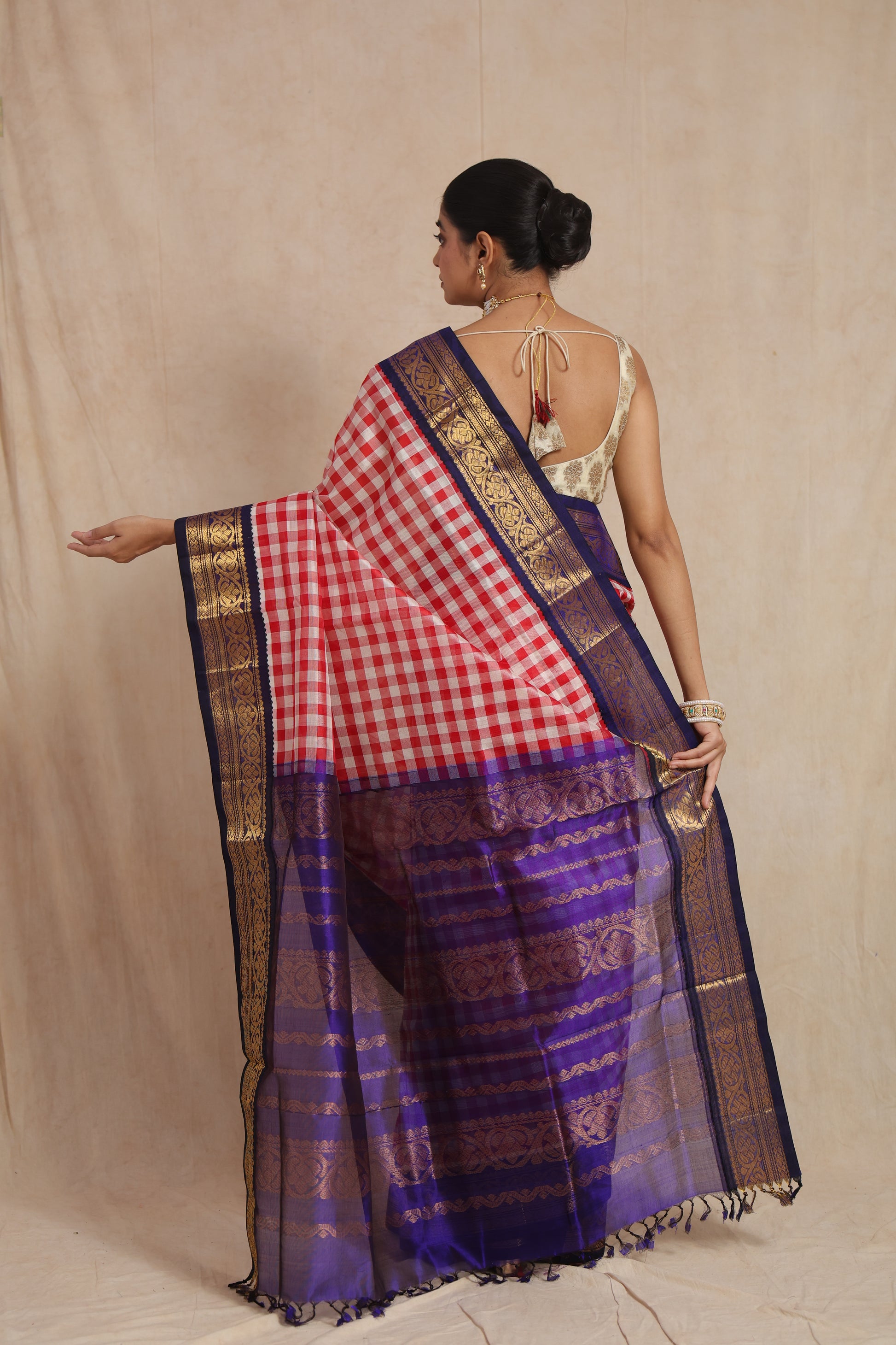 Back view of red and white checked Kanchipuram Sico saree with royal blue zari pallu