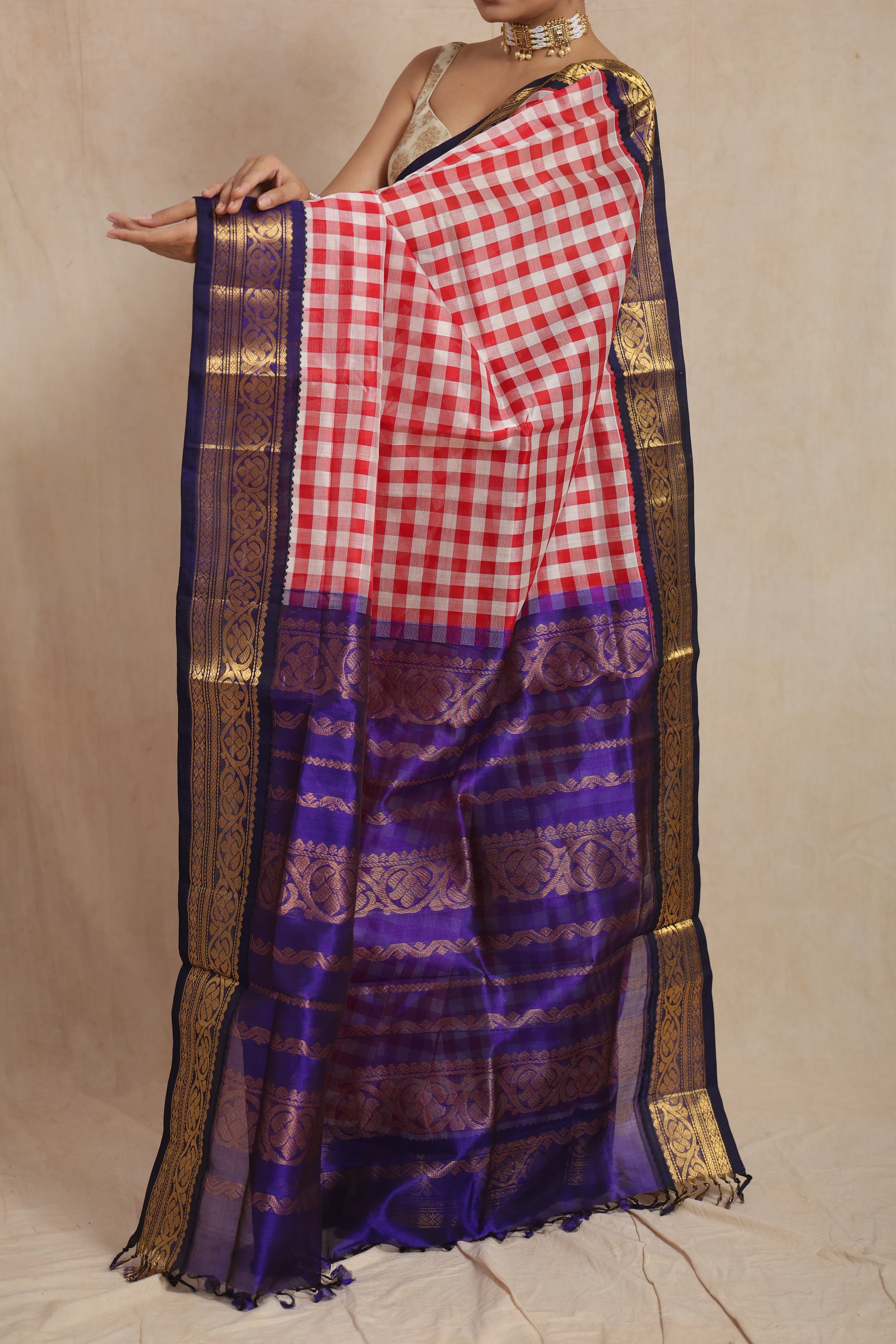 Detailed royal blue zari woven pallu of red and white checked Kanchipuram Sico saree