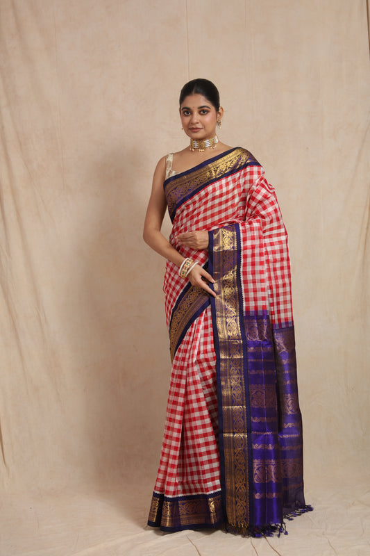 Full drape view of red and white checked Kanchipuram Sico saree with contrast blue border