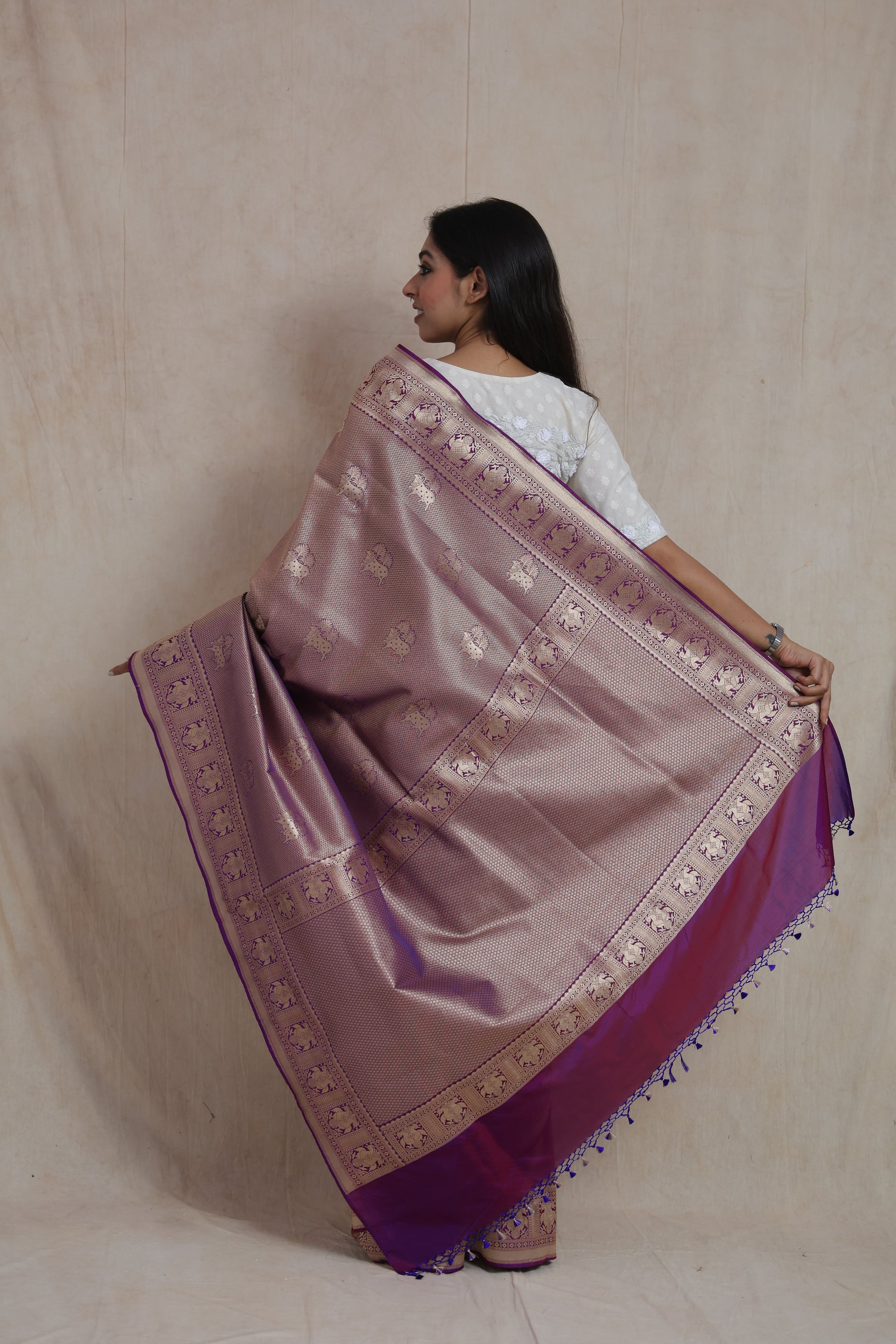 Back view of Banarasi silk saree showcasing richly woven purple pallu and elephant motif border