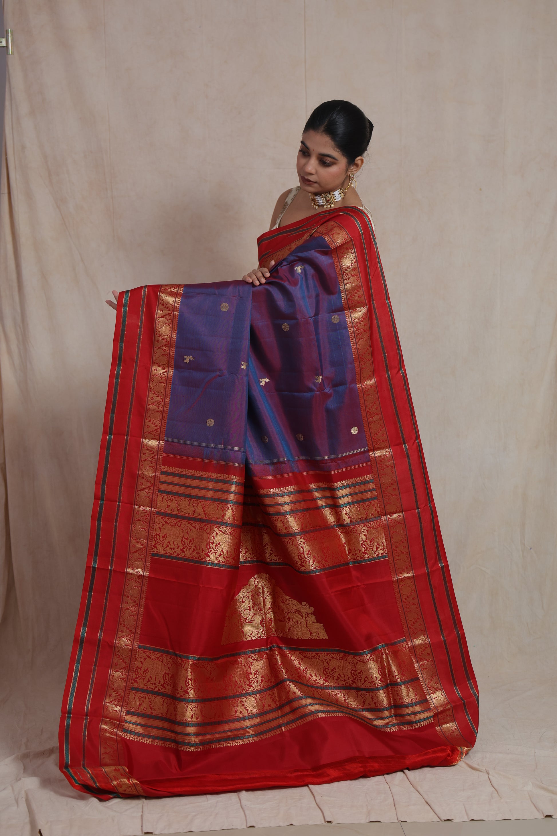 Richly woven pallu of royal violet Kanjivaram silk saree with traditional motifs