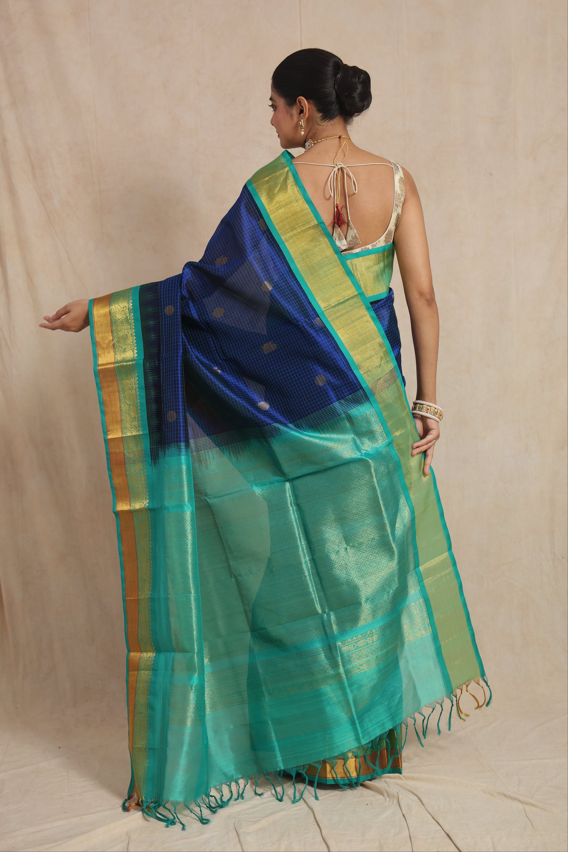 Back view of royal blue Kanchipuram Sico saree with aqua green zari pallu