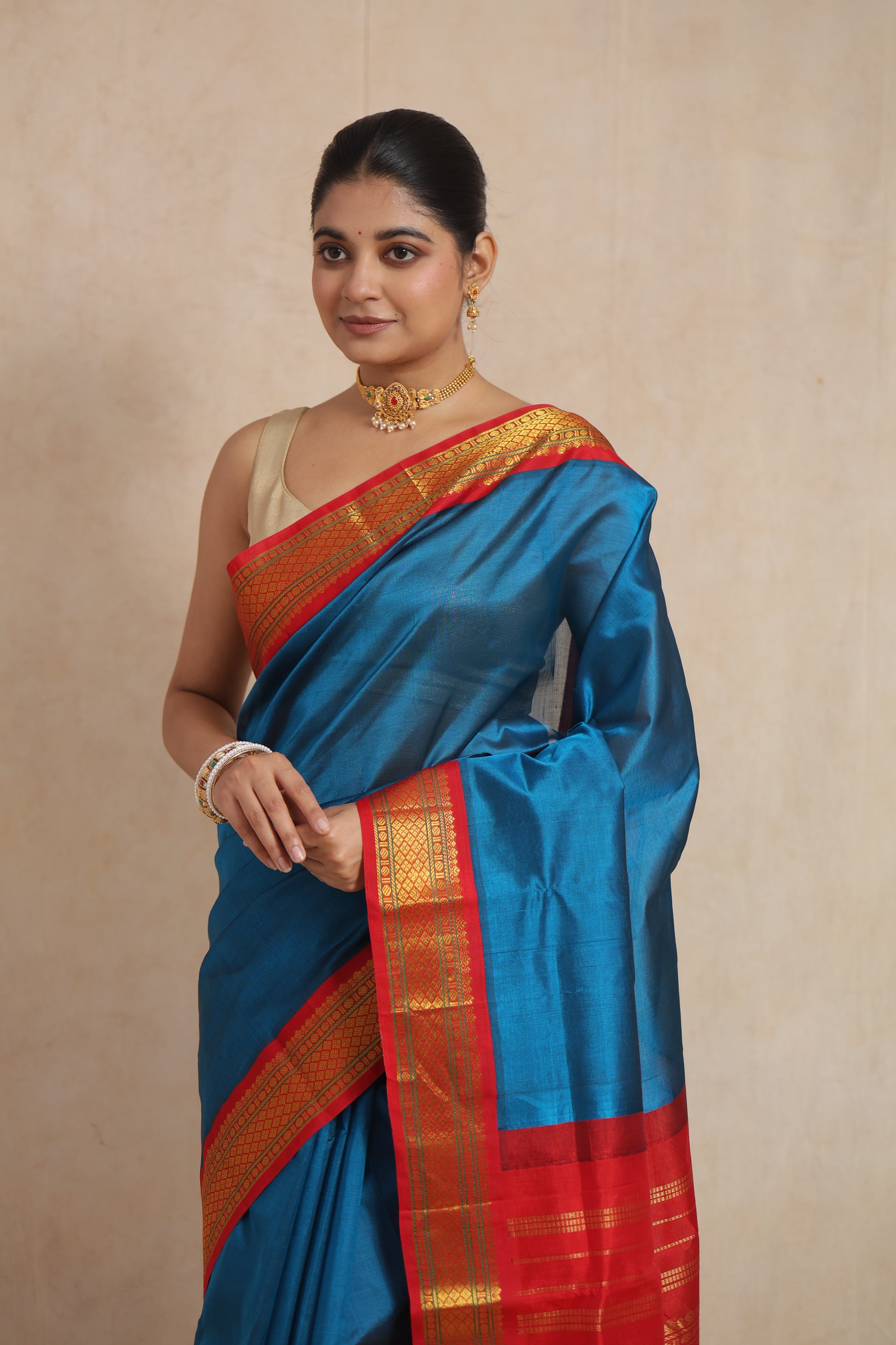 Close-up of royal blue Kanchipuram Sico saree with golden zari woven border