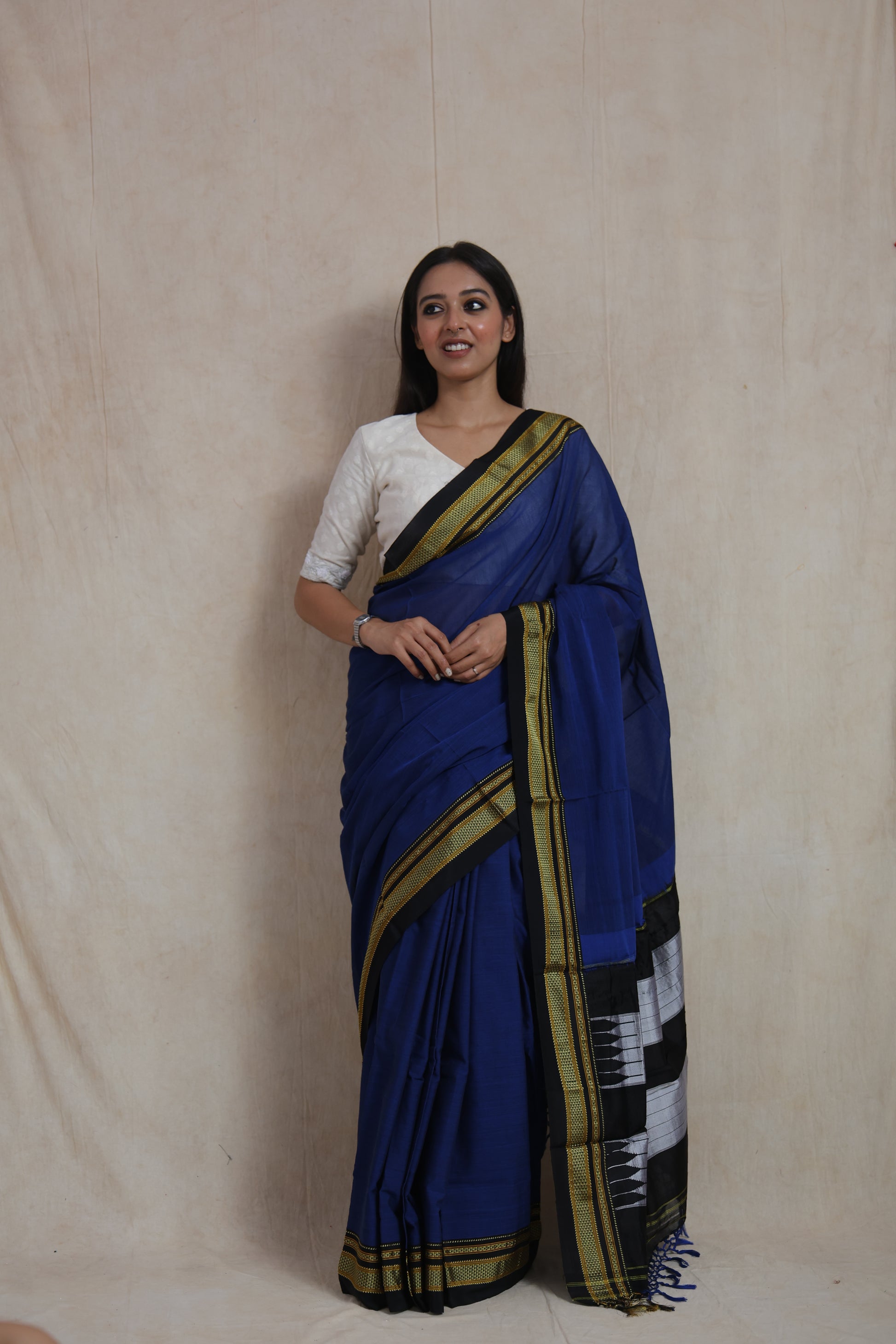 Front view of royal blue Ilkal handloom cotton saree with contrast black border and pallu