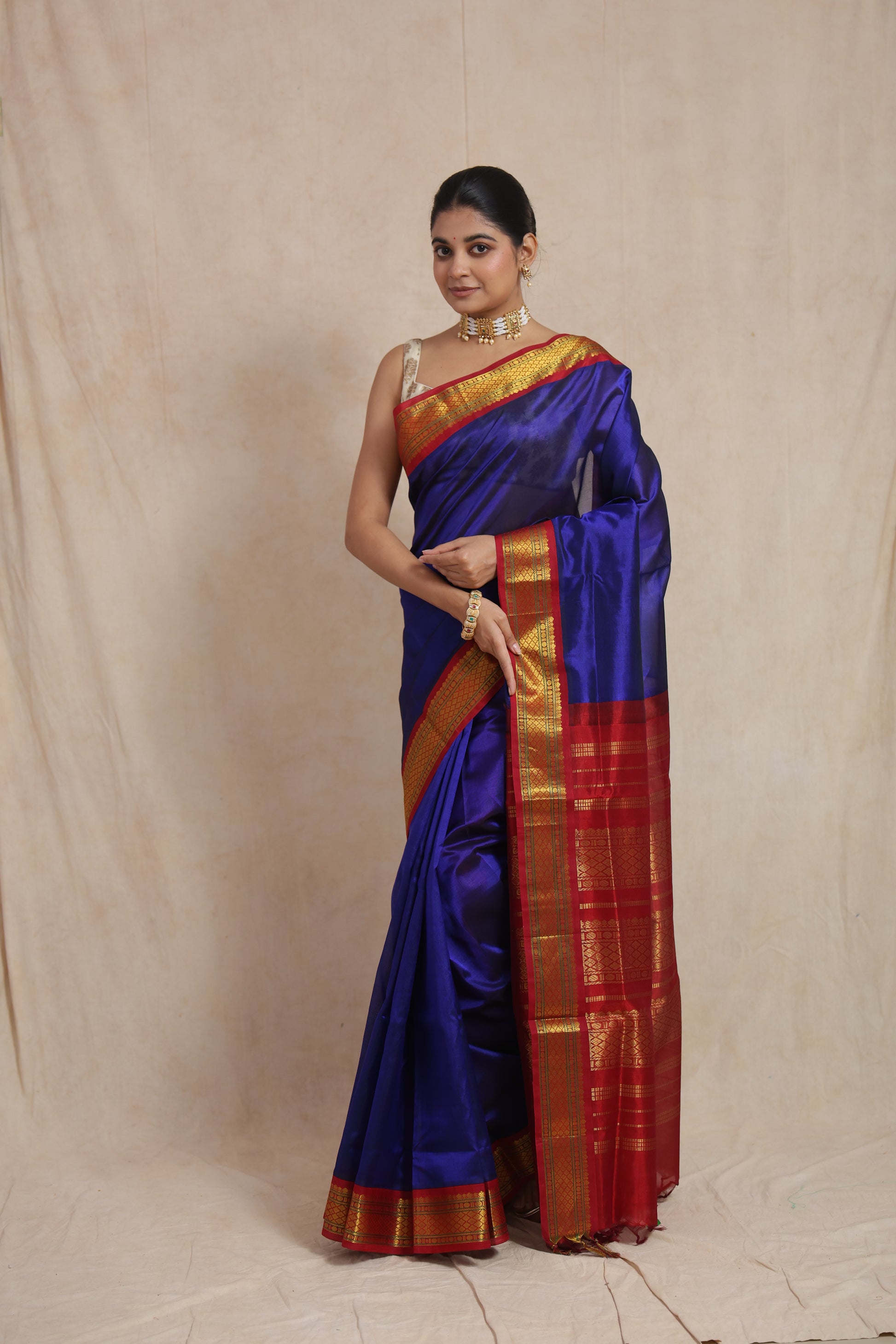 Full view of royal blue Kanchipuram Sico saree with rich red zari border