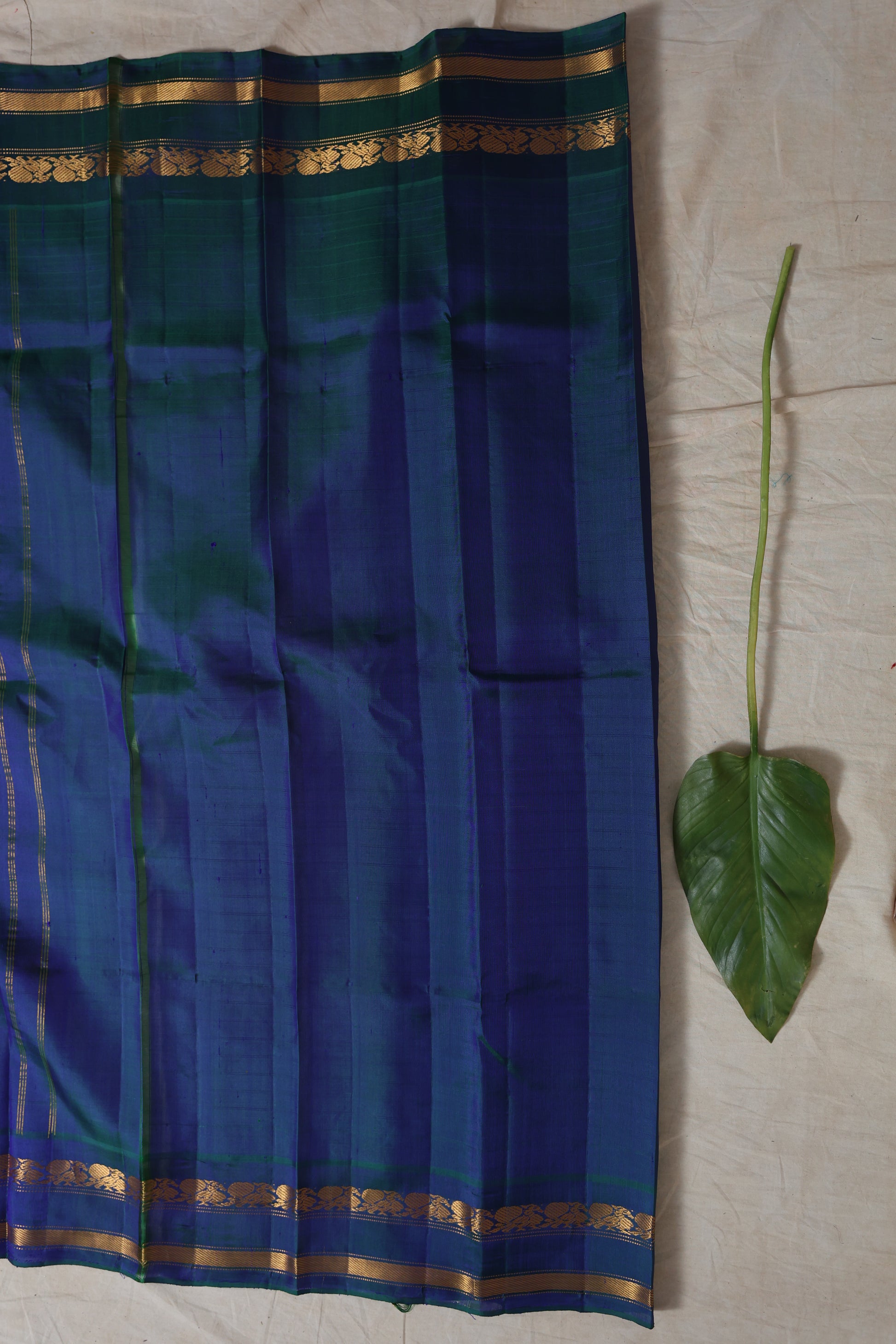 Close-up of royal blue zari woven pallu on ivory Gadwal silk saree