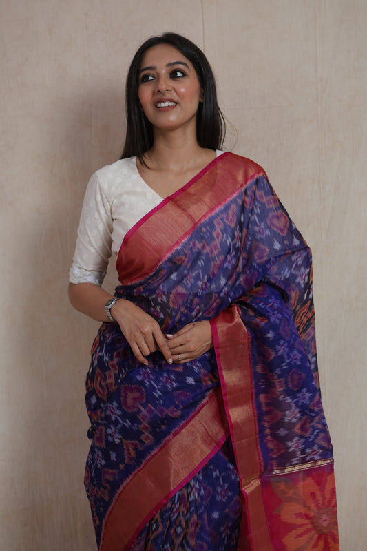 Detailed view of royal blue Panchampali handloom silk cotton saree featuring geometric Ikat motifs and vibrant floral pallu design