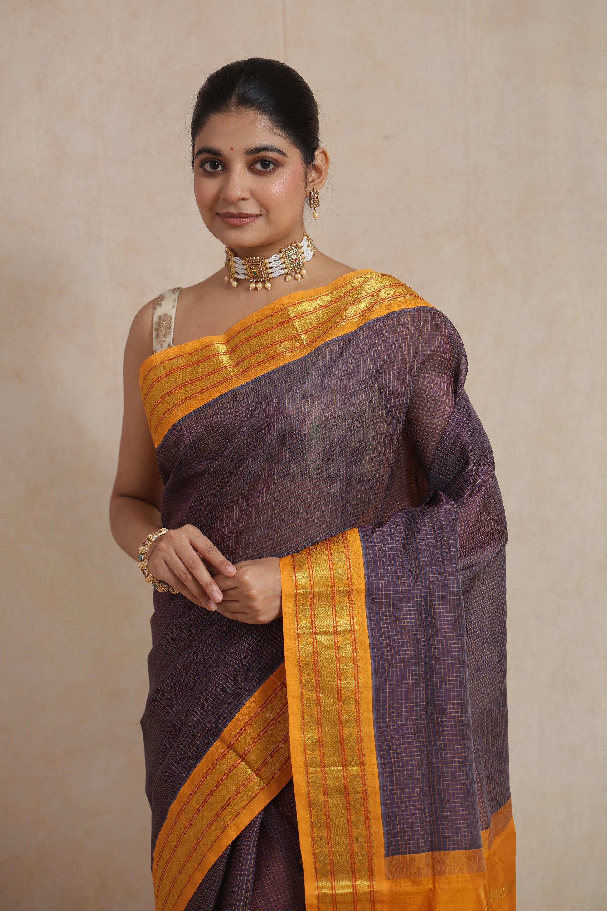 Close-up of royal indigo Kanchipuram Sico saree with golden woven border