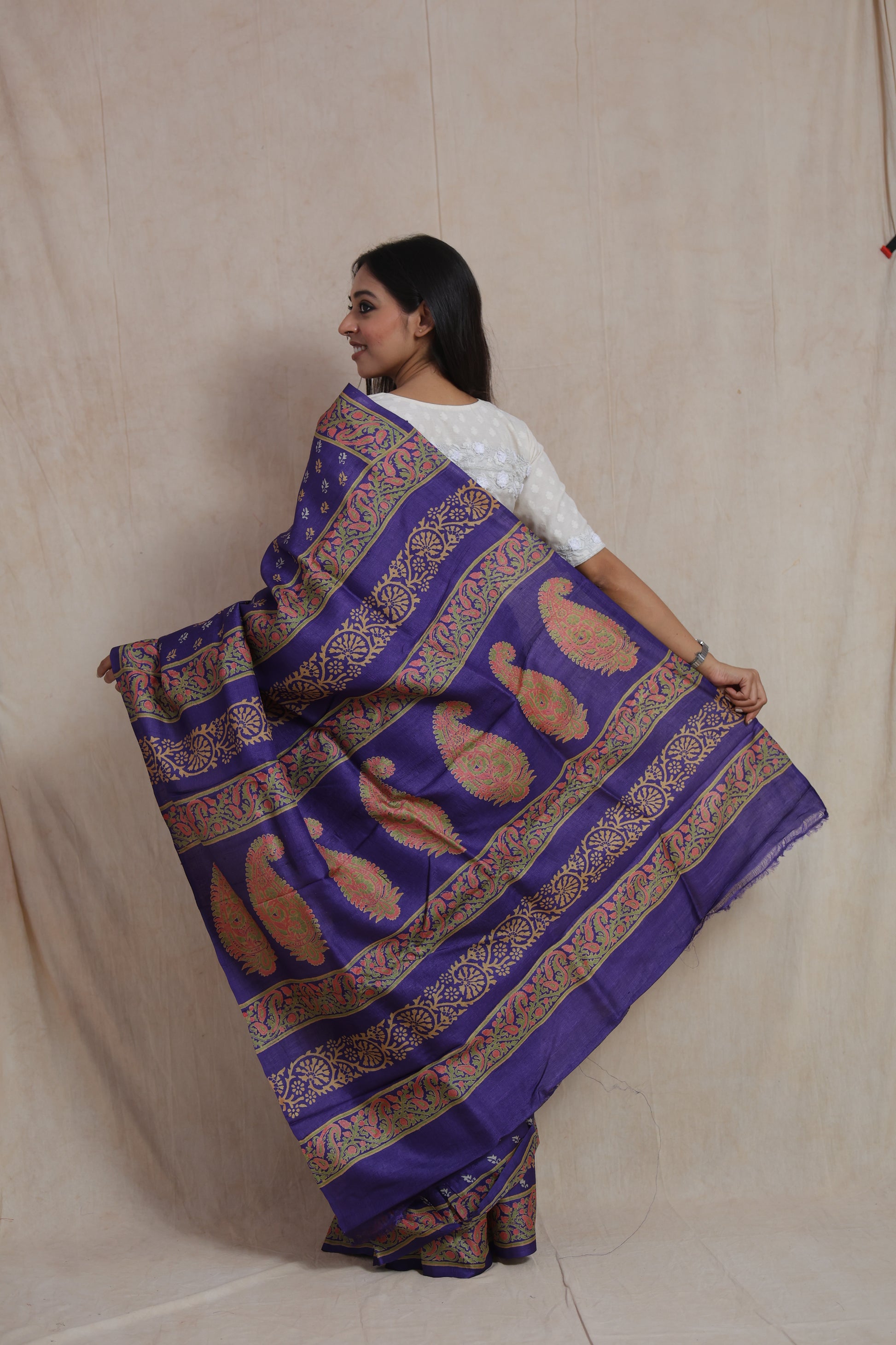 Back pallu display of indigo Tussar print saree with paisley motifs