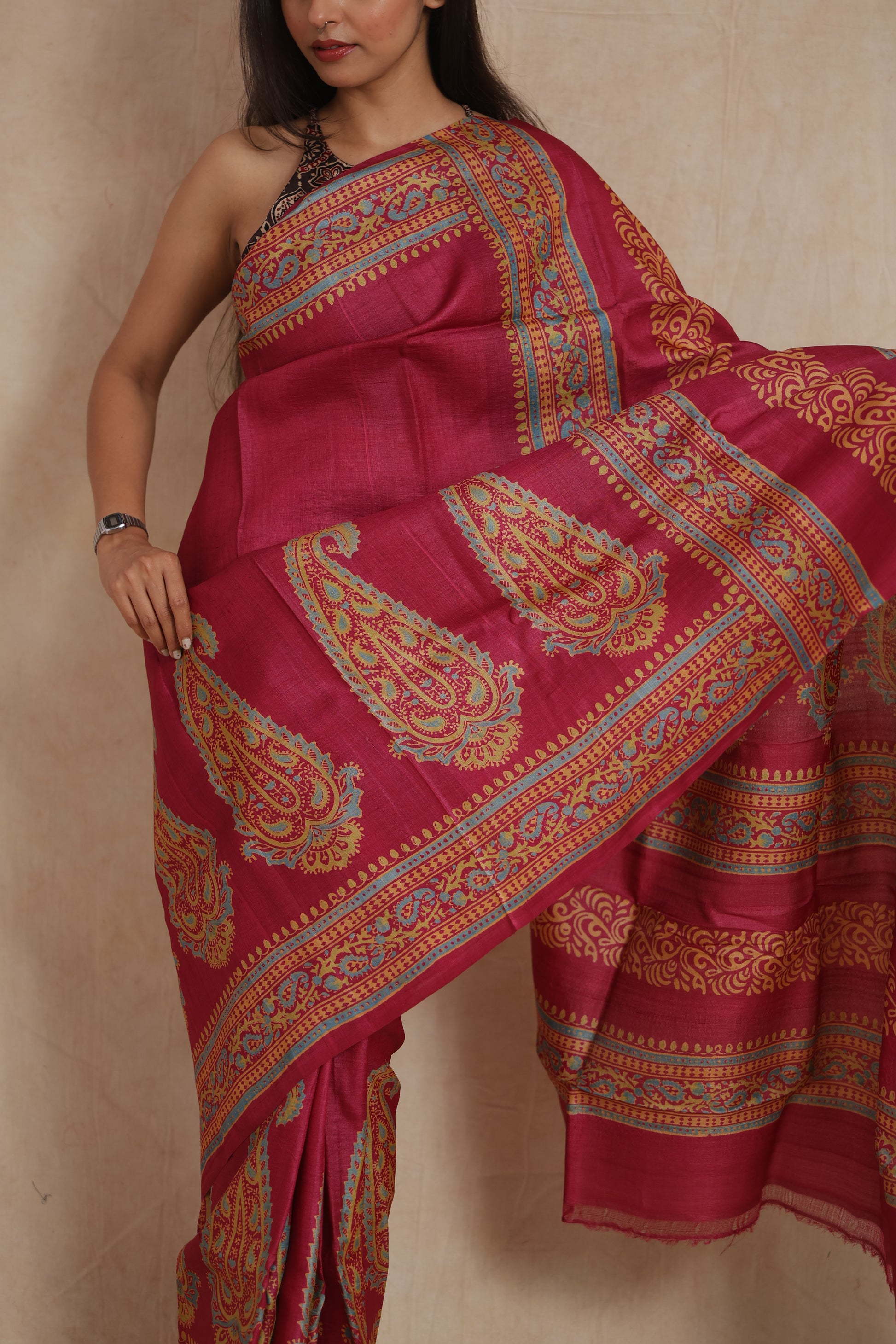 Close-up of royal magenta Tassar print saree with heritage-inspired motifs