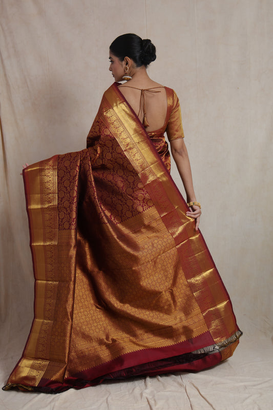 Back view of royal maroon Kanjivaram silk saree with rich golden zari pallu