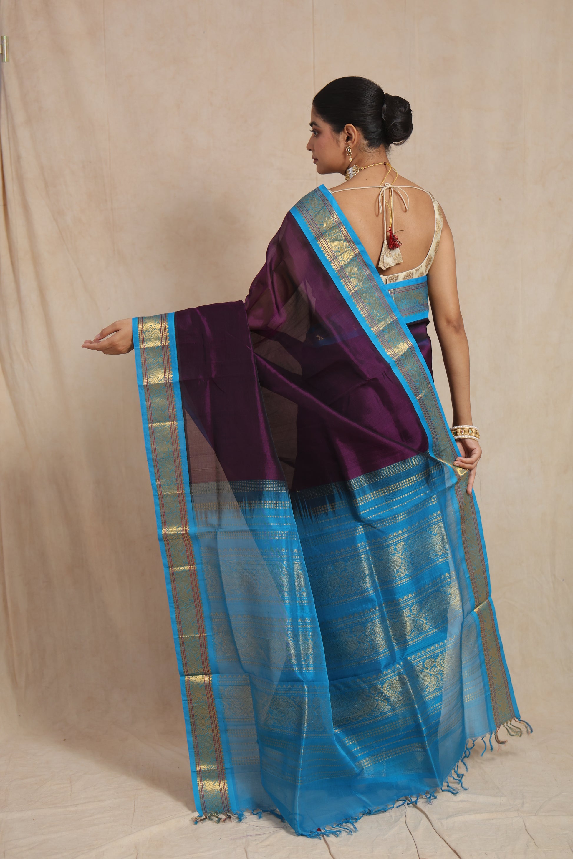 Back view of royal purple Kanchipuram Sico saree with sky blue zari pallu