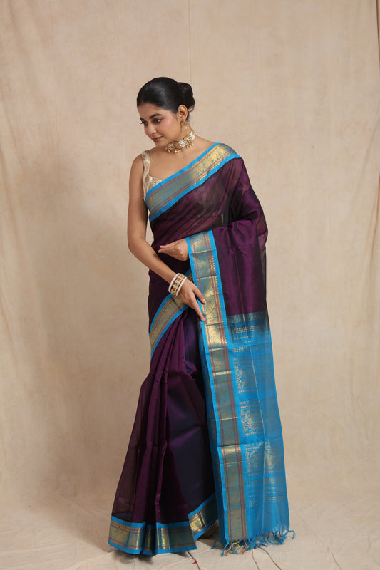 Elegant look of royal purple Kanchipuram Sico saree with traditional zari detailing