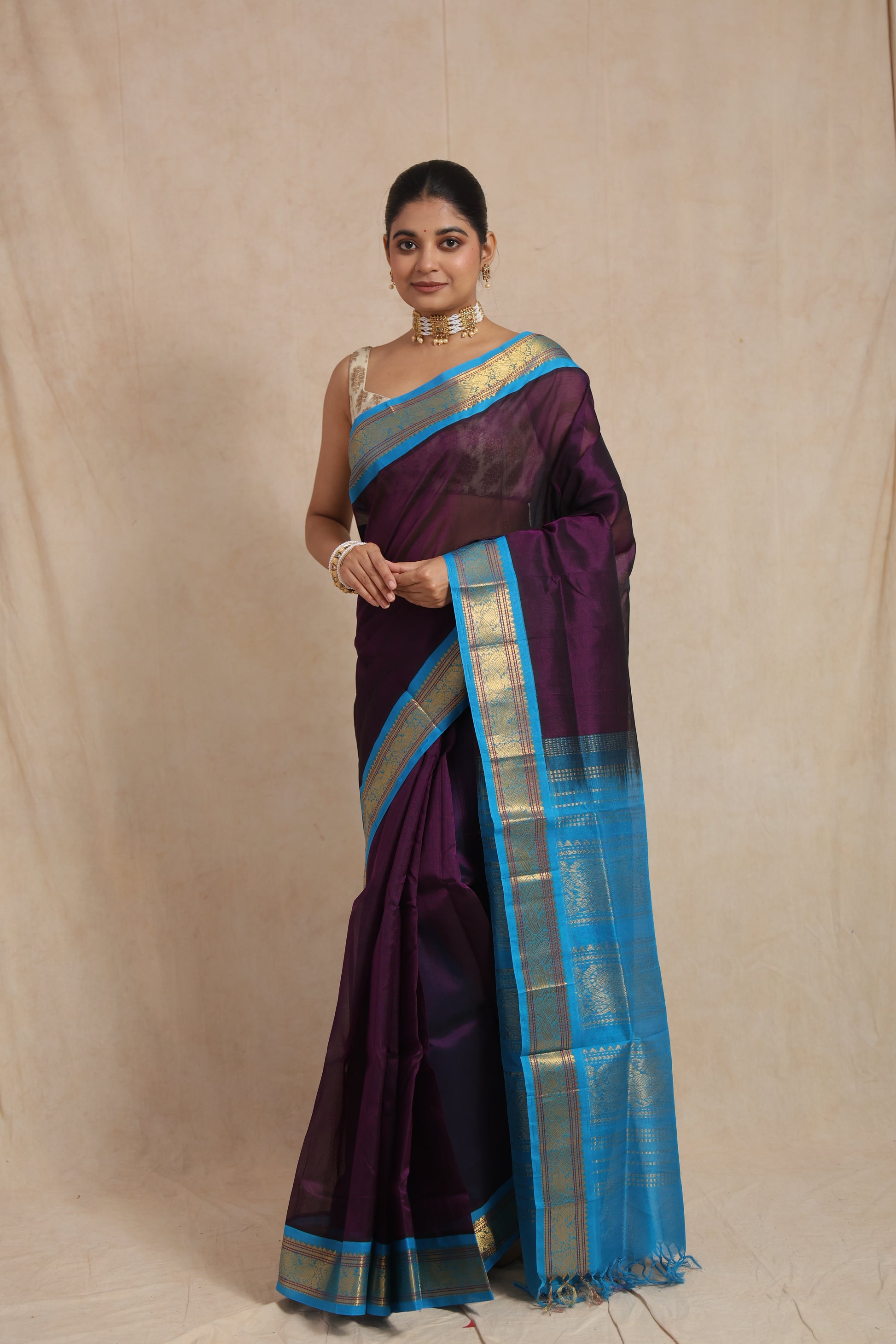 Full drape view of royal purple Kanchipuram Sico saree with contrast blue border