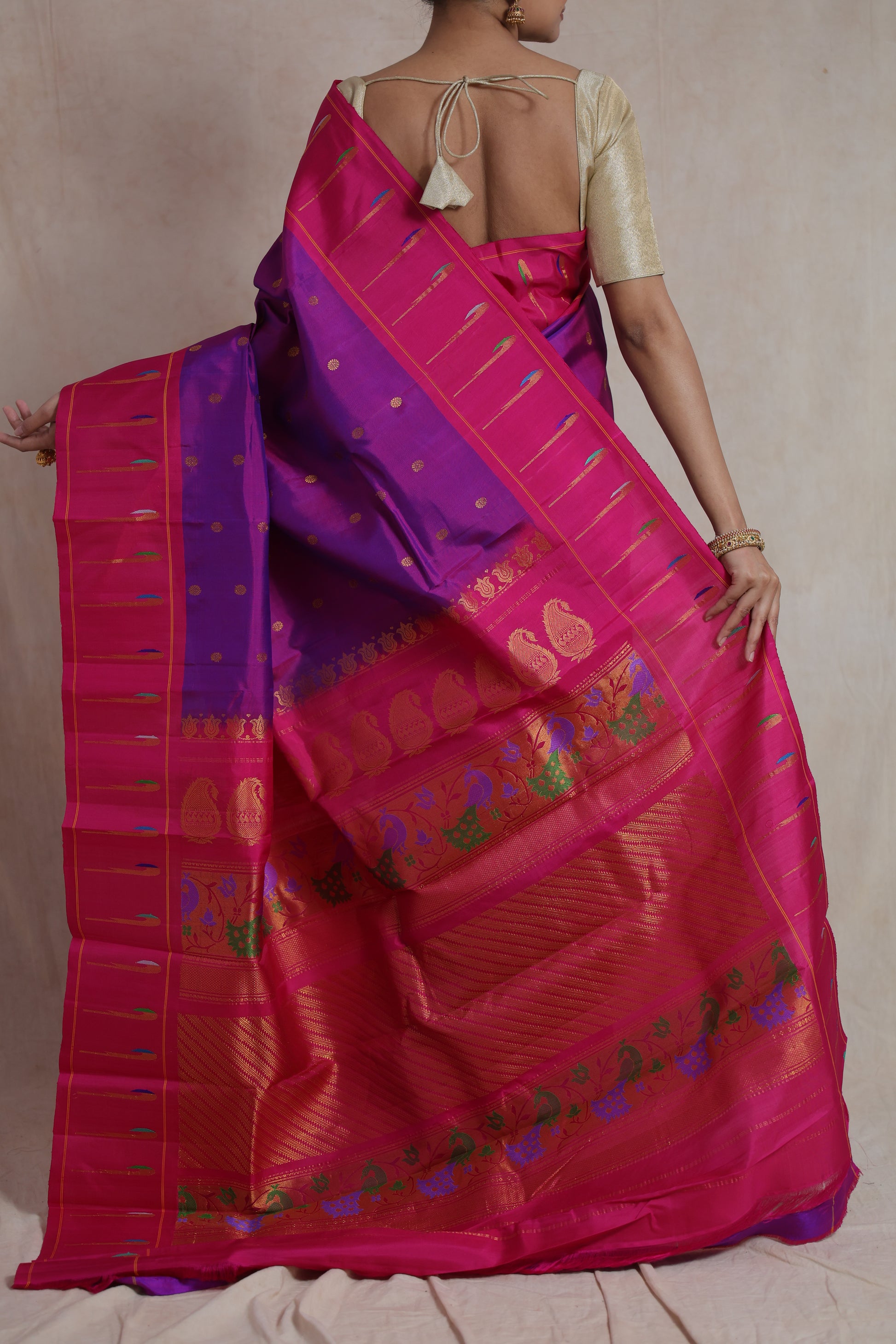 Back pallu view of royal purple Gadwal Silk saree with rani pink woven border