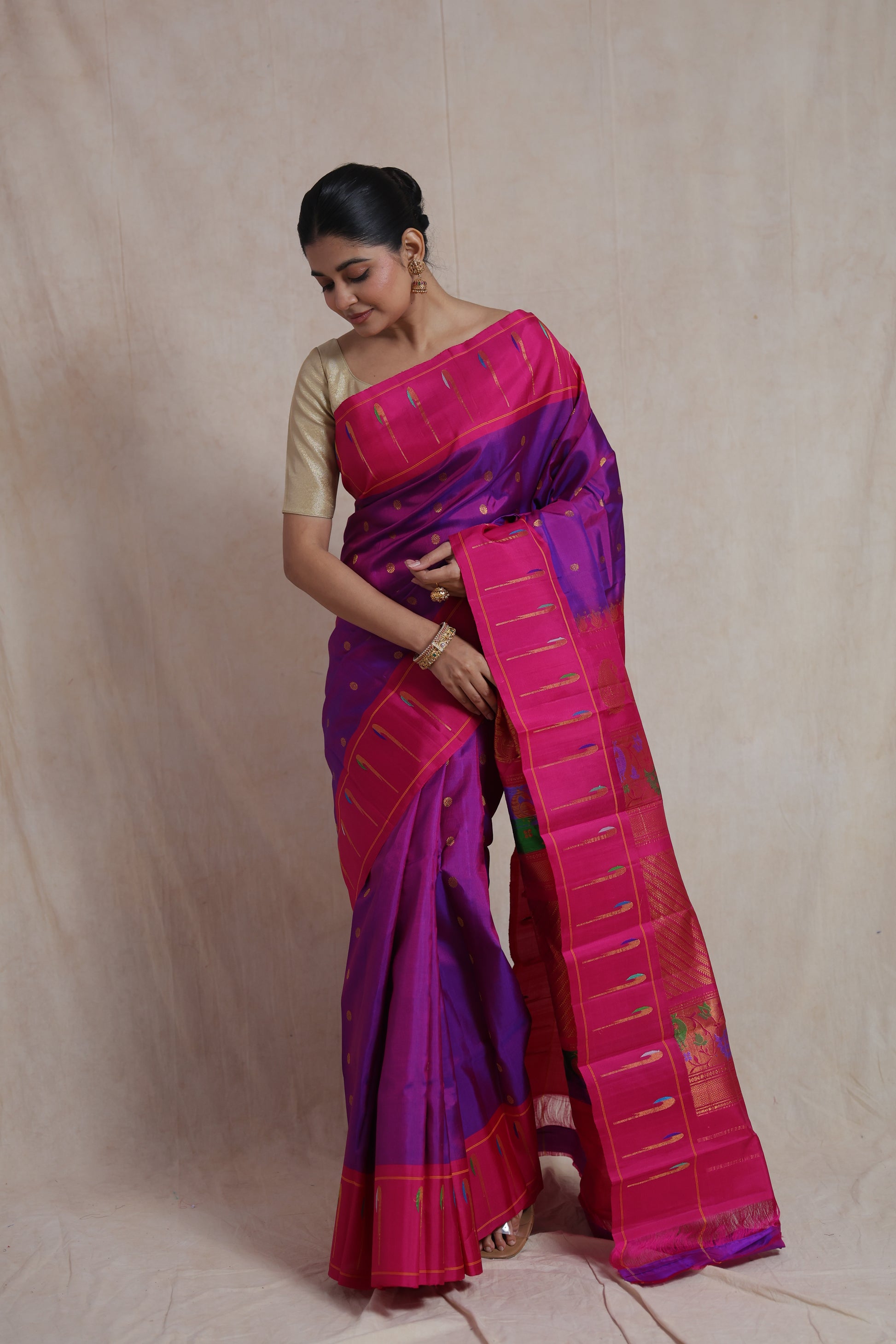 Elegant front drape of royal purple Gadwal Silk saree with pink border