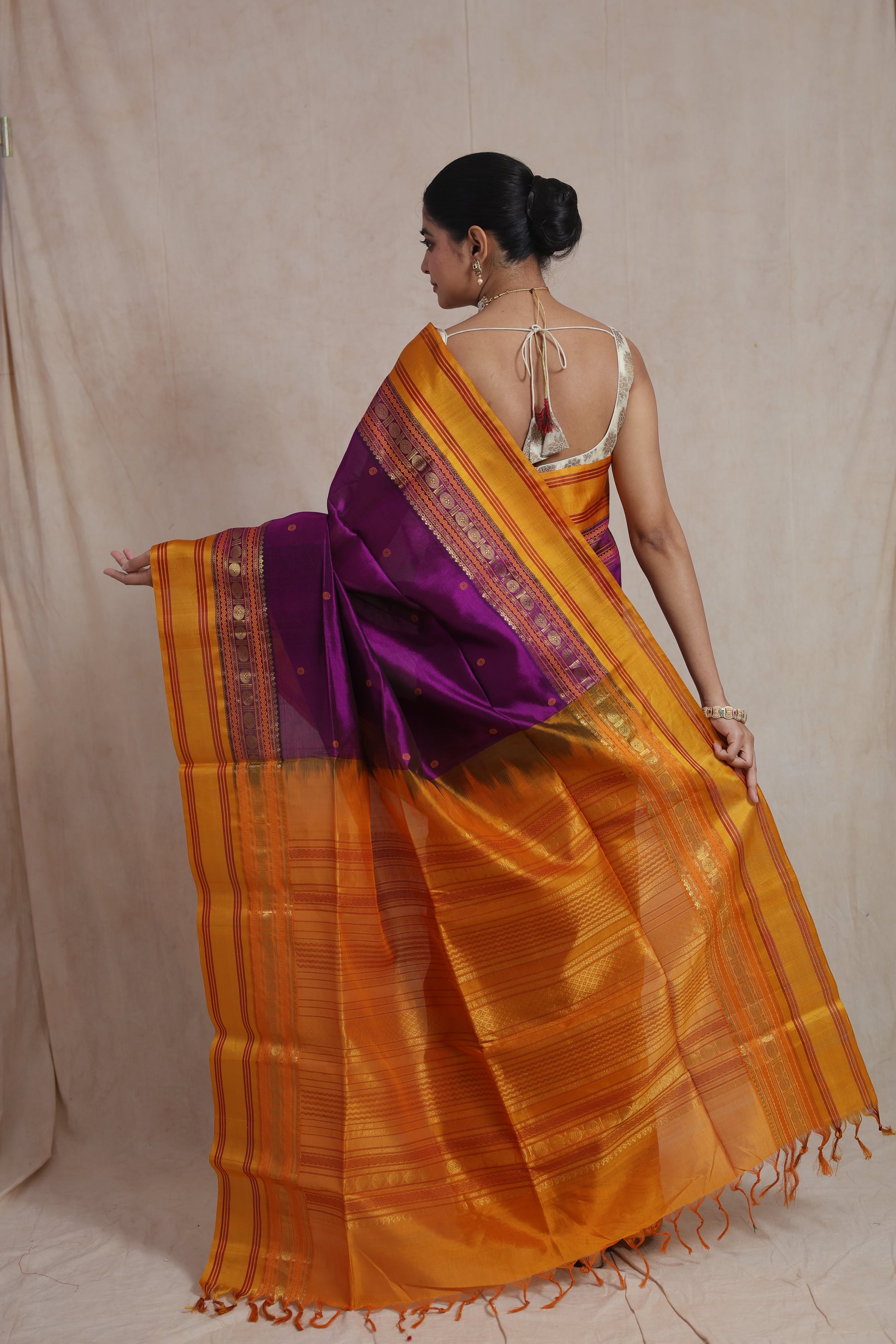 Back view of royal purple Kanchipuram Sico saree with golden woven pallu