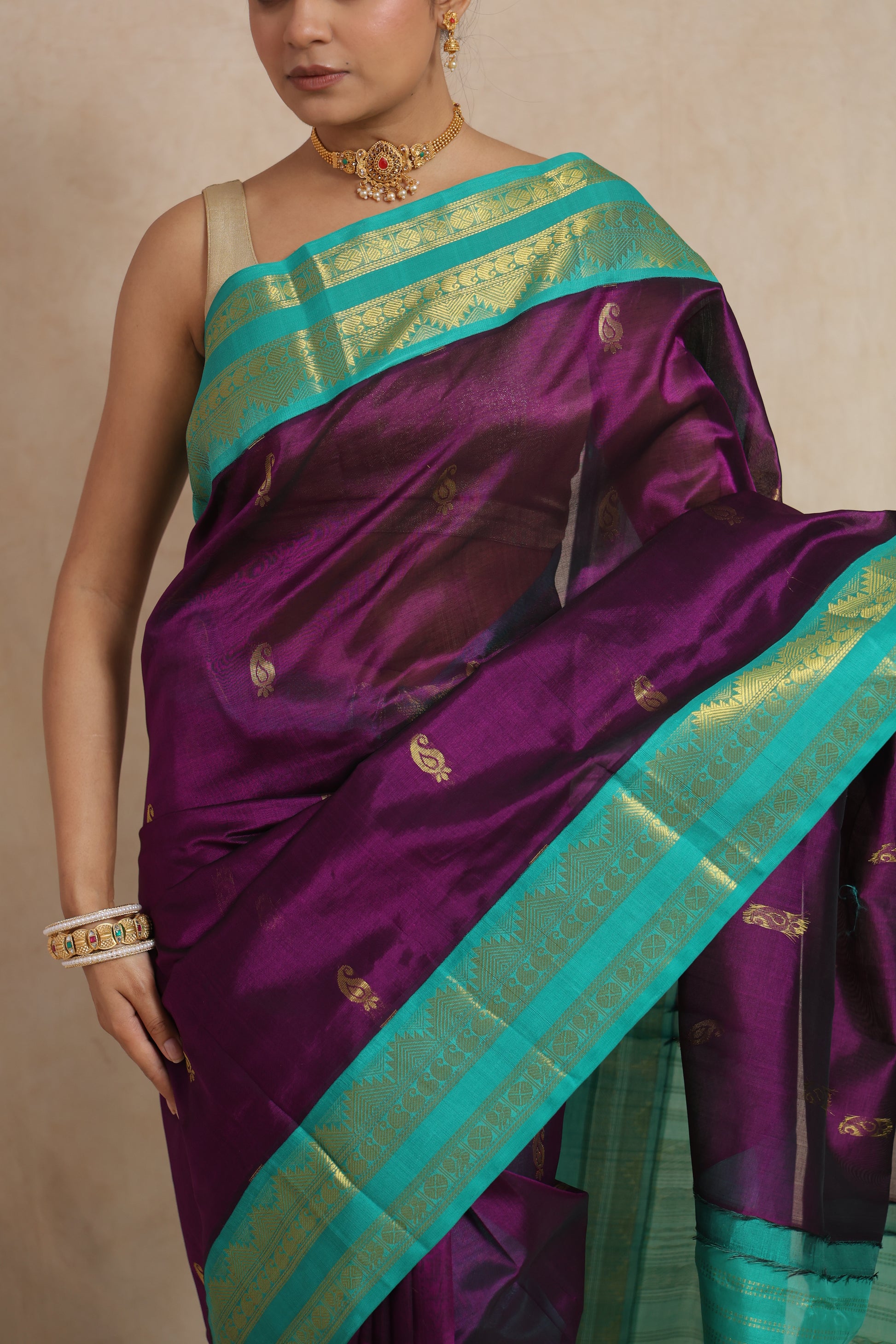 Detailed border view of royal purple Kanchipuram Sico saree with aqua zari weaving